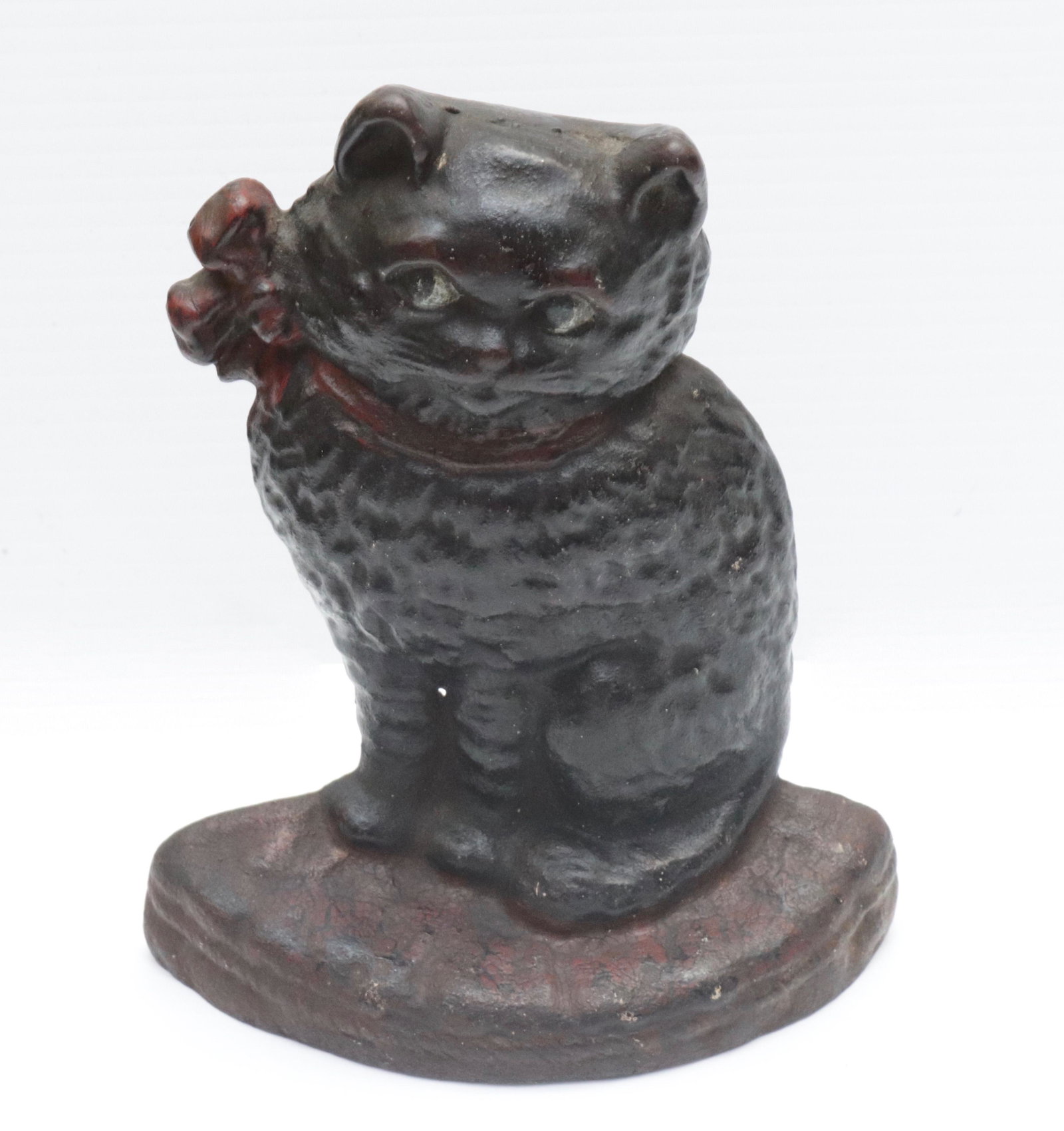 CAST IRON CAT DOORSTOP: CAT WITH BOW. PAINTED SURFACE 7.5" H
