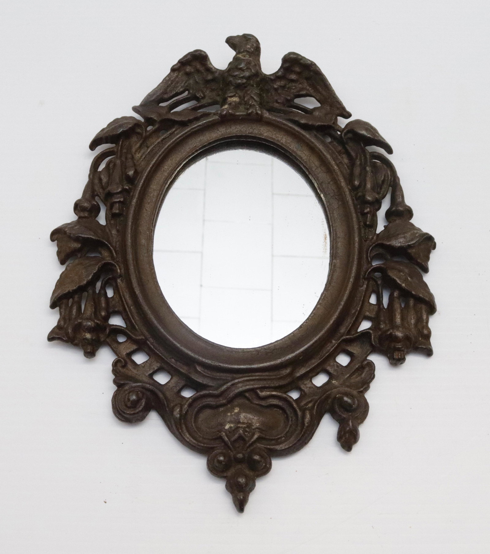 ANTIQUE CAST IRON MIRROR: EAGLE MOTIF. TRACES OF ORIGINAL PAINT 12.5" H