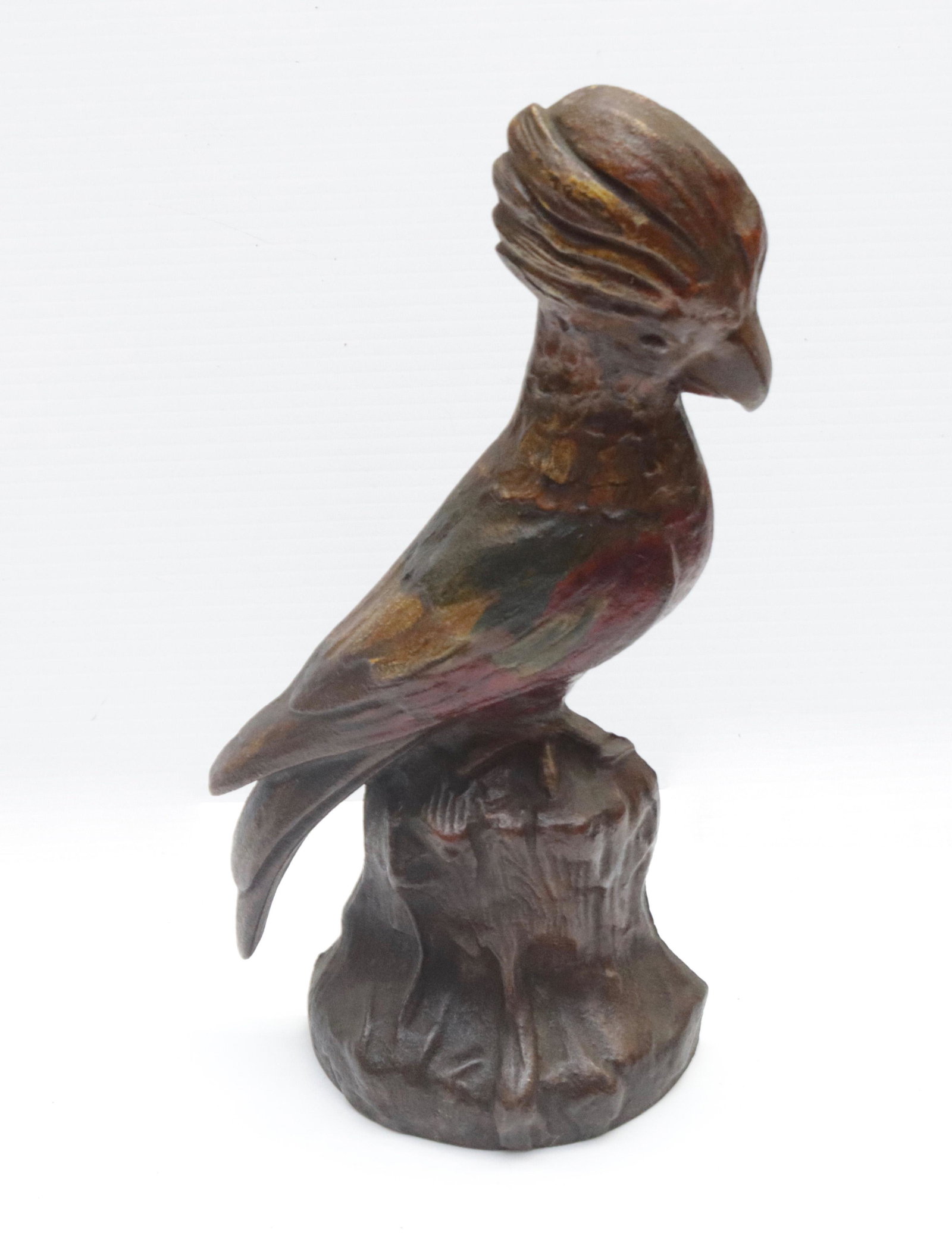 CAST IRON COCKATOO DOORSTOP: SITTING ON STUMP. PAINTED SURFACE. MRKD. 82 ON BACK 11.5" H