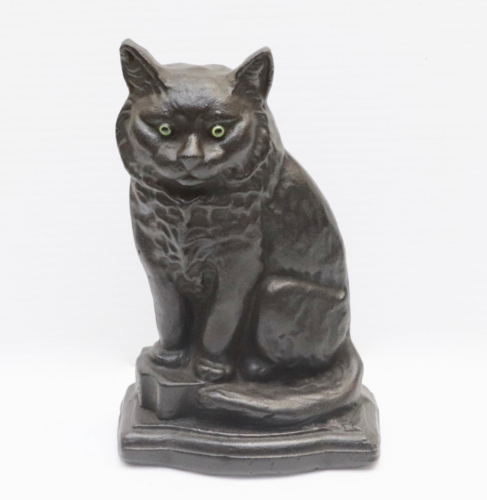 CAST IRON CAT DOORSTOP: GLASS EYES. PAINTED SURFACE. MRKD. PAT PEND ON BACK 7.5" H