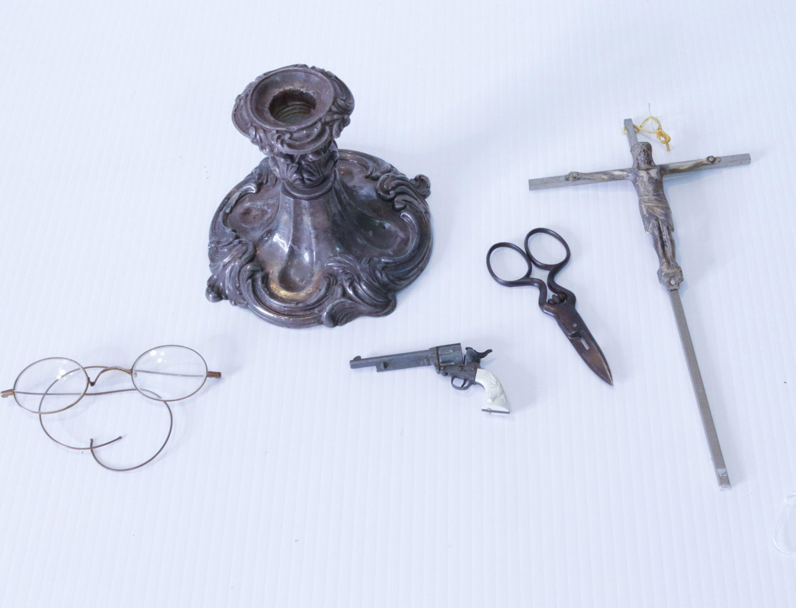 GROUP LOT OF SMALLS: (6) INCLUDING: CRUCIFIX, CANDLEHOLDER, EYEGLASSES, SCISSORS AND MINIGUN Size: CRUCIFIX IS 9. 75" L