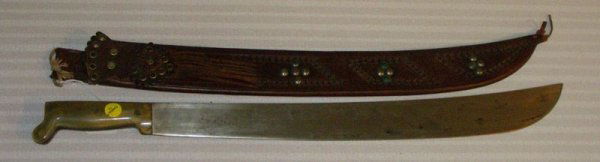 BONE HANDLE MACHETE IN TOOLED LEATHER SHEATH MARK: BONE HANDLE MACHETE IN TOOLED LEATHER SHEATH MARKED W/ AGERO FUNDIDO APPROX 25" IN GOOD CONDITION