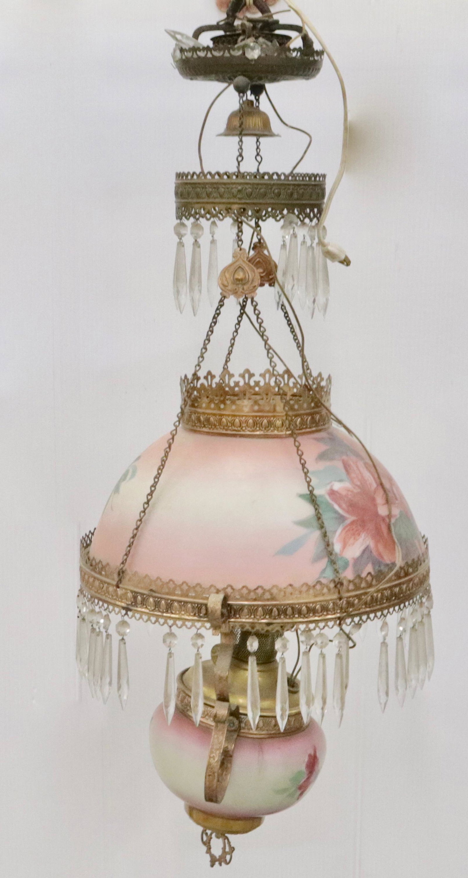 ANTIQUE ALADDIN HANGING LIGHT: PAINTED SURFACE, METAL TRIM WITH PRISMS. ELECTRIFIED. SHADE 13.5" D AND 34" L (AS SEEN IN PHOTO)