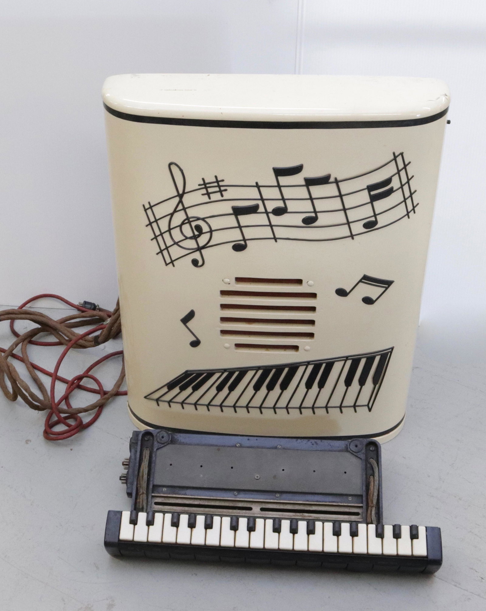 VINTAGE HAMMOND SOLOVOX TONE CABINET AND KEYBOARD: PAINTED SURFACE WITH APPLIED DECORATION CABINET IS 27" X 21.5"