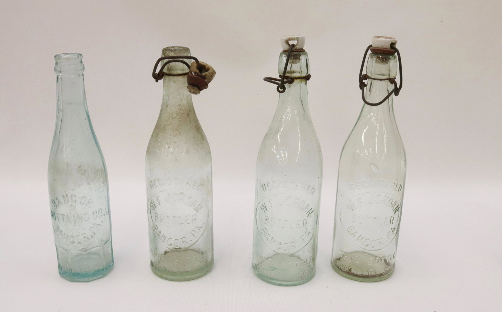 GROUP LOT OF BANGOR BOTTLES: (4) THREE WF JORDAN BANGOR AND BANGOR BOTTLING CO. 9" H