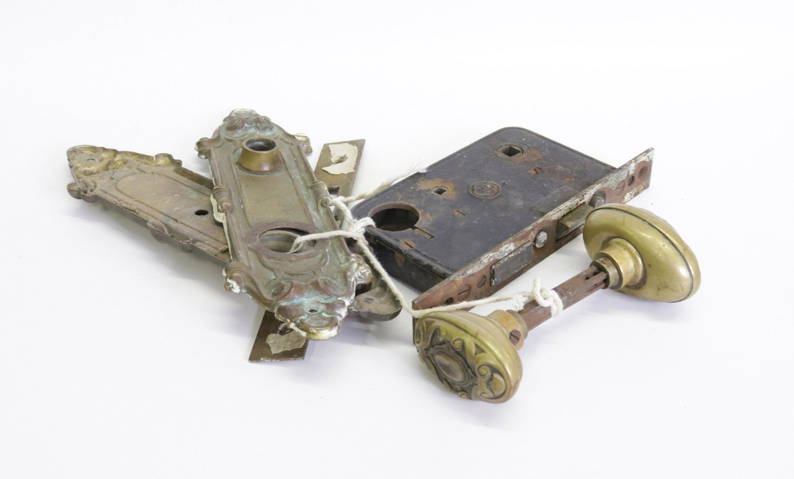 ANTIQUE DOOR HARDWARE: PAIR OFBRASS KNOBS AND SURROUNDS. CAST IRON LOCKING MECHANISM KNOBS 3" D