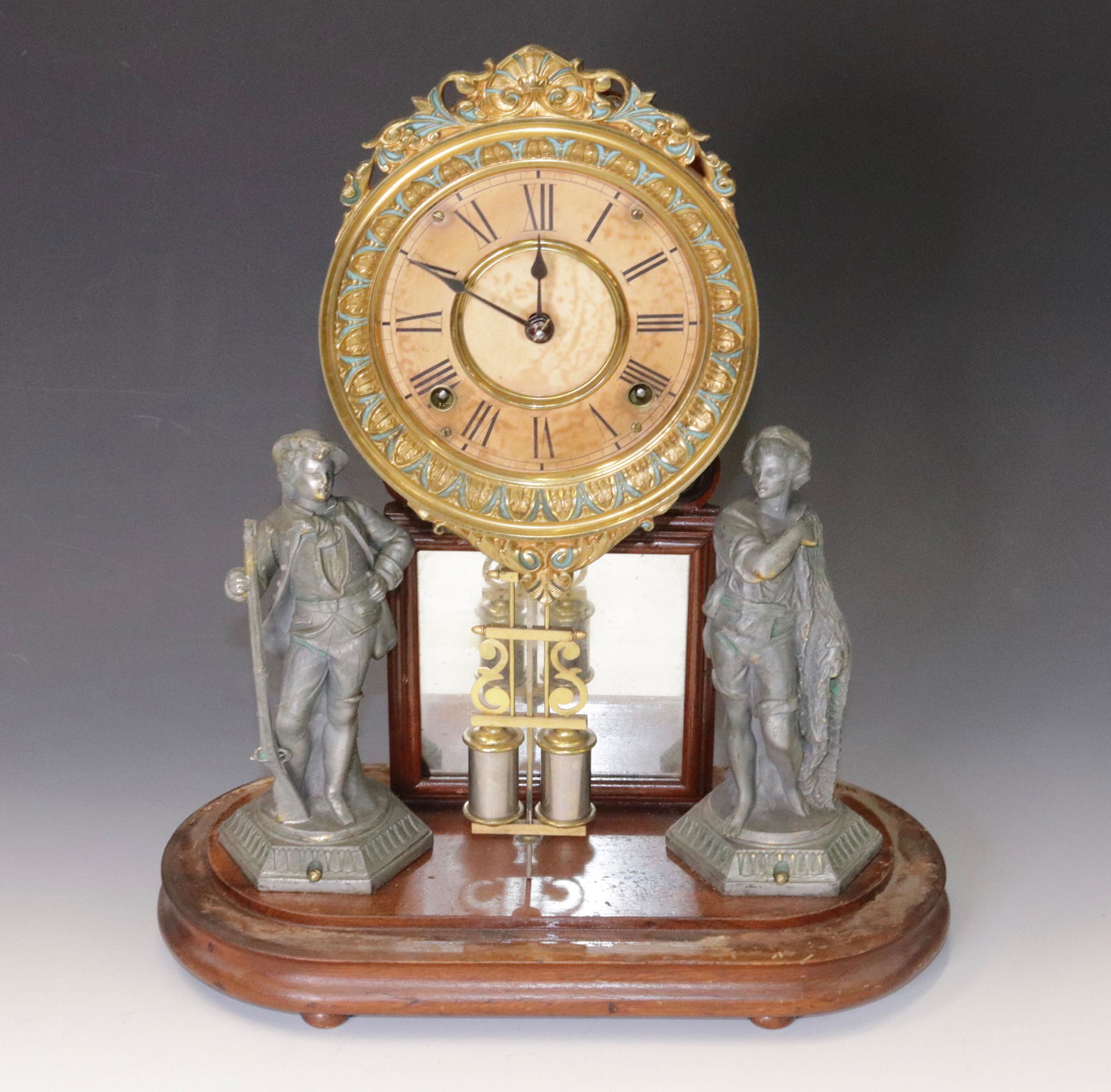 ANSONIA CRYSTAL PALACE CLOCK: MANTEL CLOCK WITH STATUES SURROUNDING CENTER MIRROR. PAPER ON ZINC DIAL. ORIGINAL PENDULUM TOTAL HEIGHT 16.5"