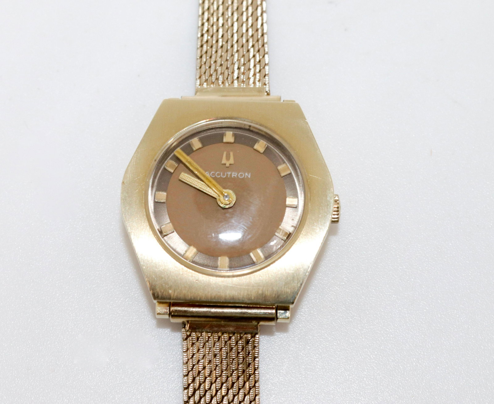 14K LADIES BULOVA WATCH: BULOVA ACCUTRON WATCH IN ORIGINAL BOX. GOLD PLATE BAND WITH GOLD CASE #51871. NEEDS BATTERY