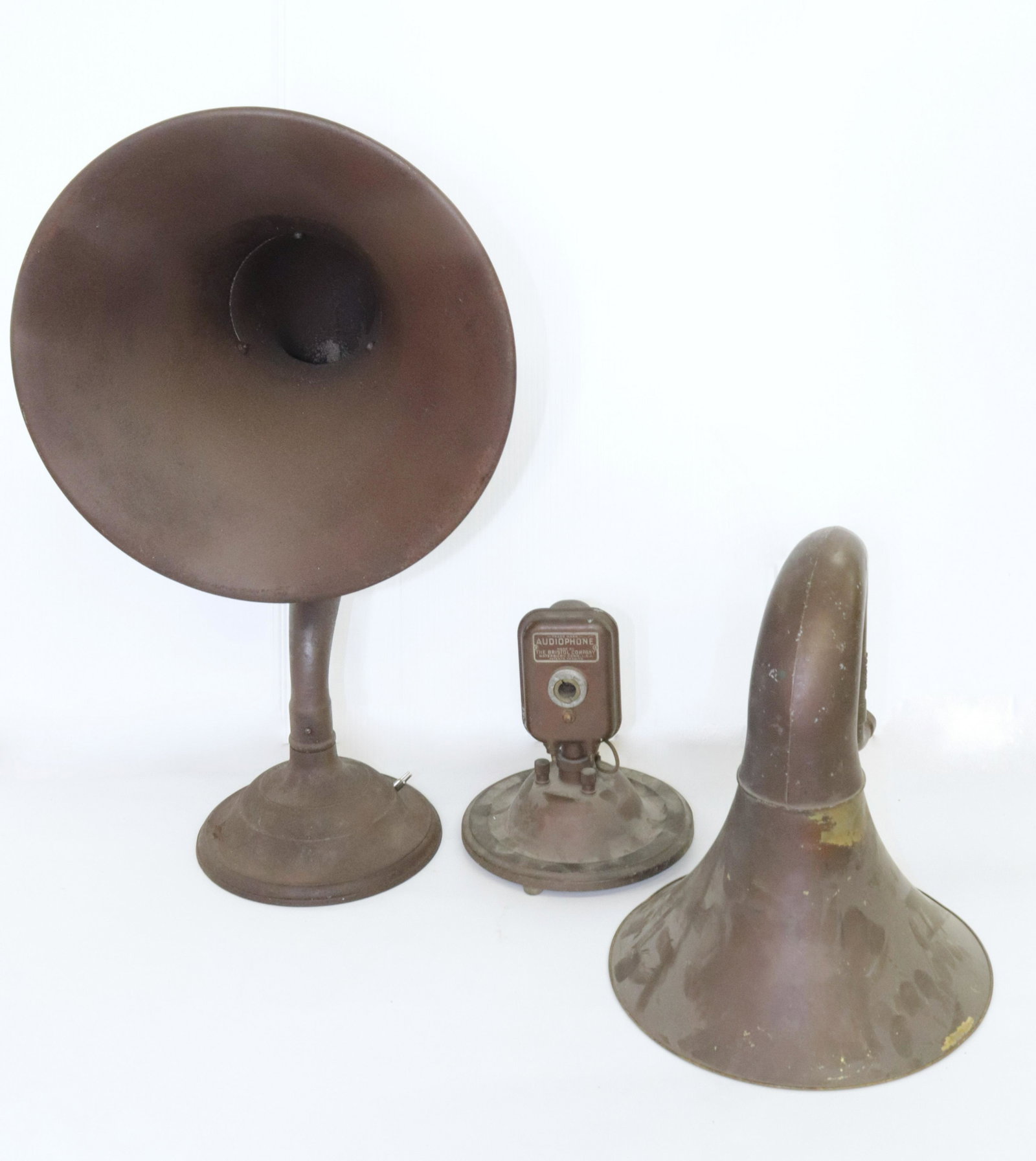 (2) RADIO HORN SPEAKERS: LARGE PAINTED METAL EXAMPLE (UNMARKED) AND A TWO-PIECE AUDIOPHONE BY BRISTOL WHICH IS PAINTED BRASS AND METAL 14.5" X 24.75" AND 11" D OF HORN OF SMALLER