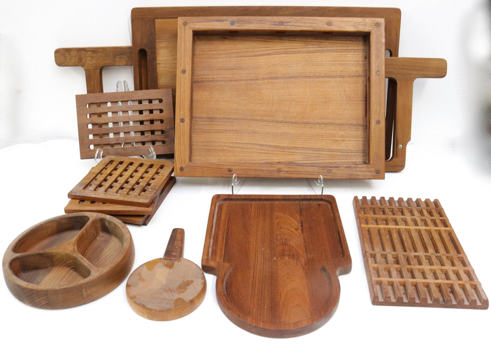 GROUP LOT OF DANSK WOODENWARE: SEVEN WOODEN TRIVETS, SMALL CHEESE BOARD WITH KNIFE HANDLE, DIVIDED DISH, CUTTING BOARD, TRAY AND LAP TRAY WITH BOX