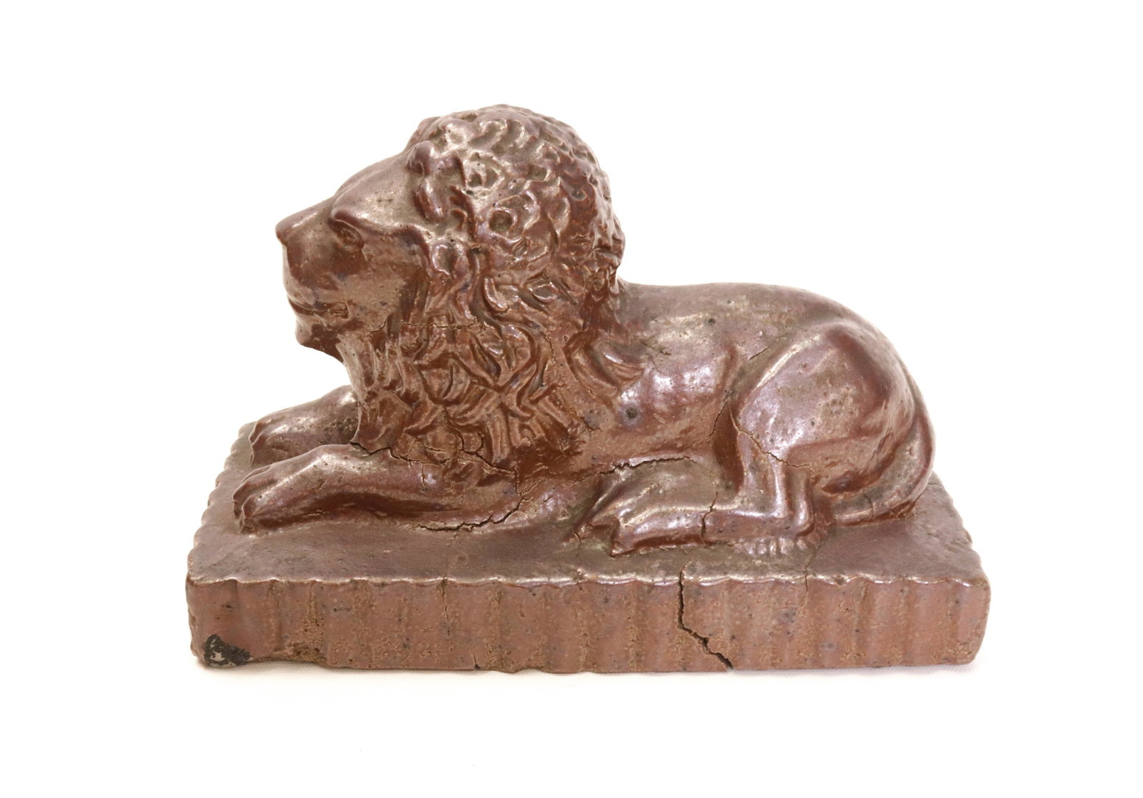 SEWER TILE LION DOORSTOP: GLAZED RECLINING LION 6.75" X 10" X 4.75"