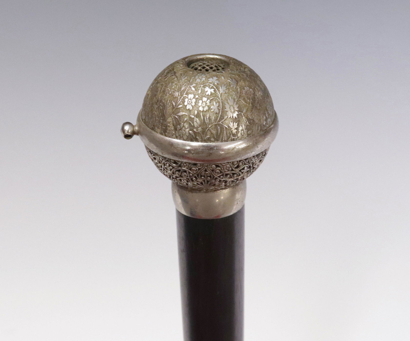 GREEK SIREN GADGET CANE: SILVER DECORATED HANDLE - TOP UNSCREWS TO REVEAL WORKS MARKED WITH MAKERS NAME AND INVENTORY NUMBER - SILVER COLLAR ON EBONY SHAFT BELOW BALL 36 1/2" L