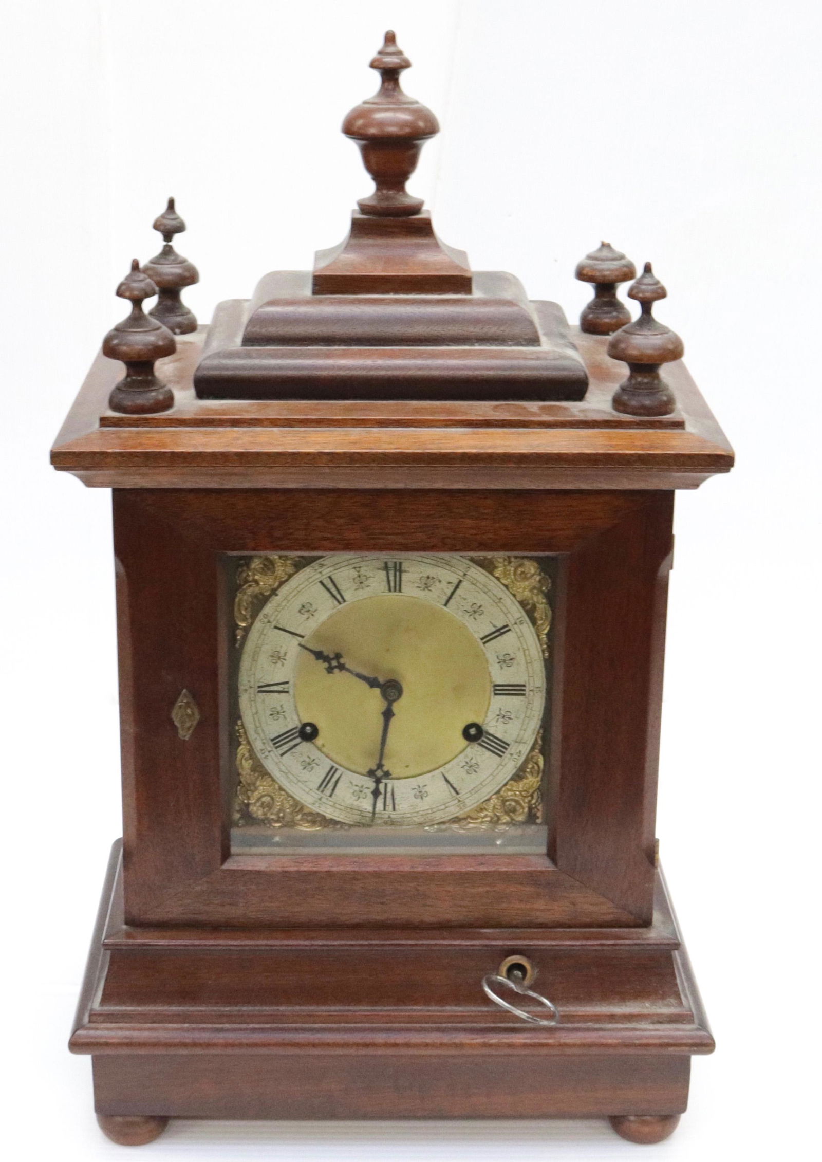 OAK BRACKET MANTLE CLOCK: BRASS PAINTED DIAL. BRASS WORKS MRKD. WILCOCK PAT. WESTMINSTER CHIMES. KEY AND PENDULUM 20 1/2" X 12" X 8 1/2"