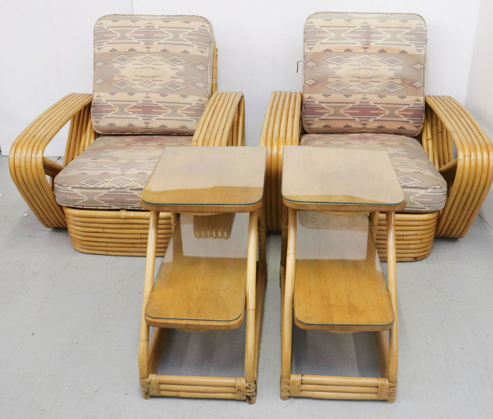 PAUL FRANKL CHAIRS AND END TABLES: INCLUDES: PAIR OF CHAIRS AND PAIR OF TIERED SIDE TABLES. UPHOLSTERED CUSHIONS AND GLASS ON FLAT SURFACES. CHAIRS 30" X 33" X 33". TIERED TABLES 21" X 25" X 13"