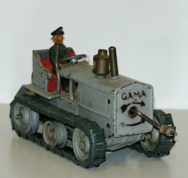 6" TIN TRACTOR - "GAMA" ON FRONT WITH CRANK - CRANK: 6" TIN TRACTOR - "GAMA" ON FRONT WITH CRANK - CRANK DOES NOTHING