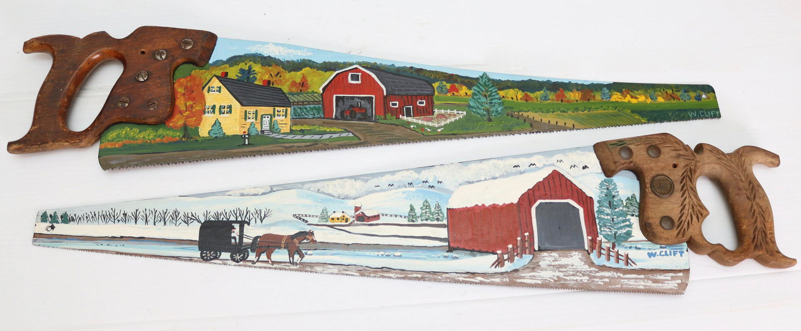 PAIR OF PAINTED SAWS (1 of 1)
