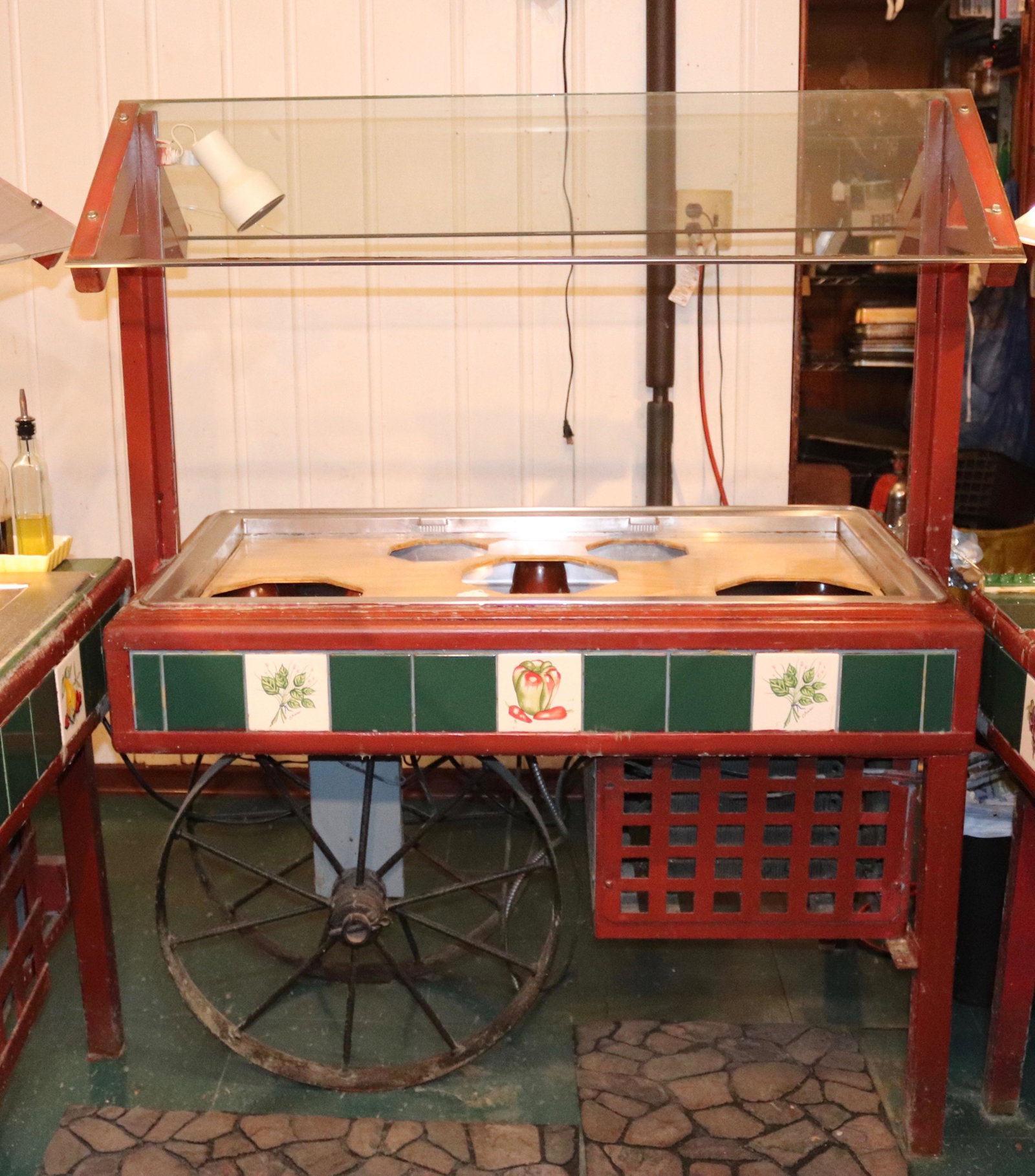 RESTAURANT SALAD BAR CART: WOOD, TILE, GLASS AND STAINLESS WITH IRON WHEELS Size 46" L Disclaimer PLEASE READ BEFORE BIDDING!!! Pick-up will be Tuesday January 5th, 2021 from 9:00am till 5:00pm and Thursday January 7th, 2021 fr