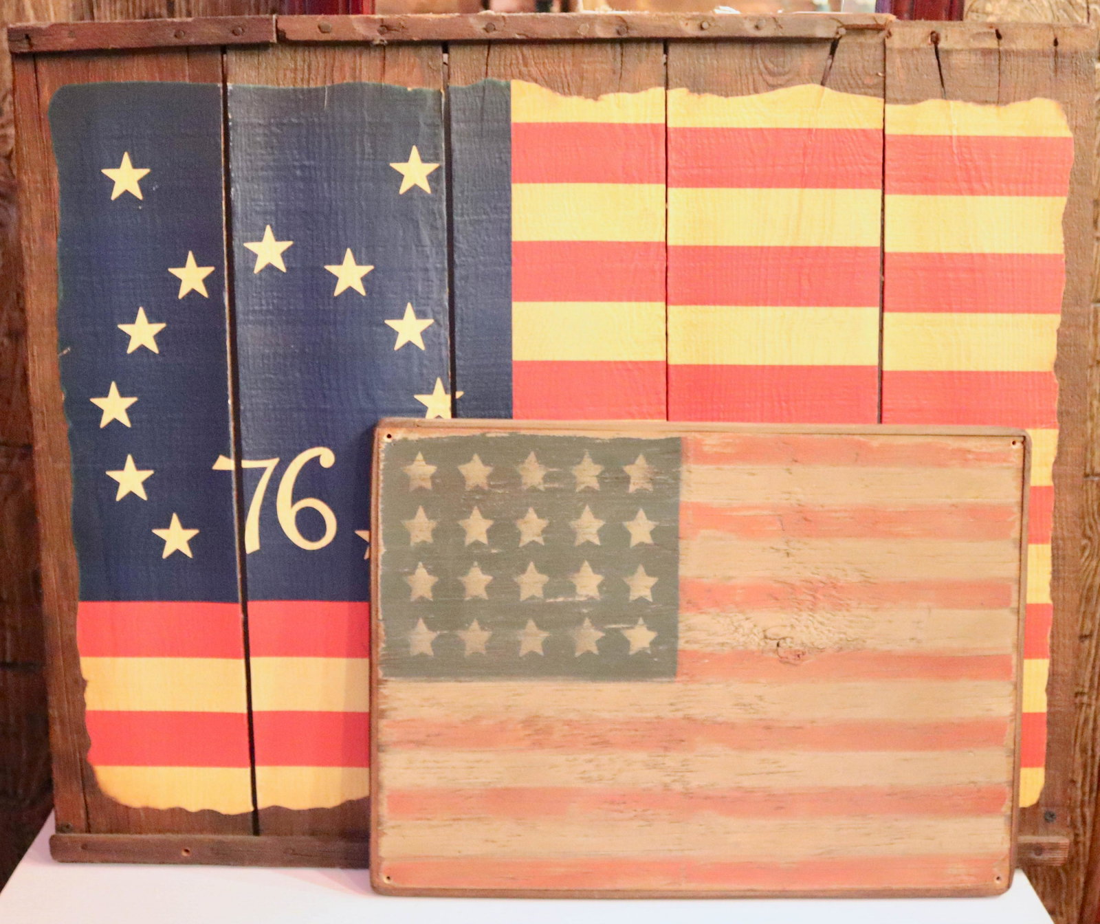 PAIR OF PAINTED AMERICAN FLAGS: PAINTED ON WOOD Size LARGE FLAG 24" X 29 1/2" Disclaimer PLEASE READ BEFORE BIDDING!!! Pick-up will be Tuesday January 5th, 2021 from 9:00am till 5:00pm and Thursday January 7th, 2021 from 9:00am till