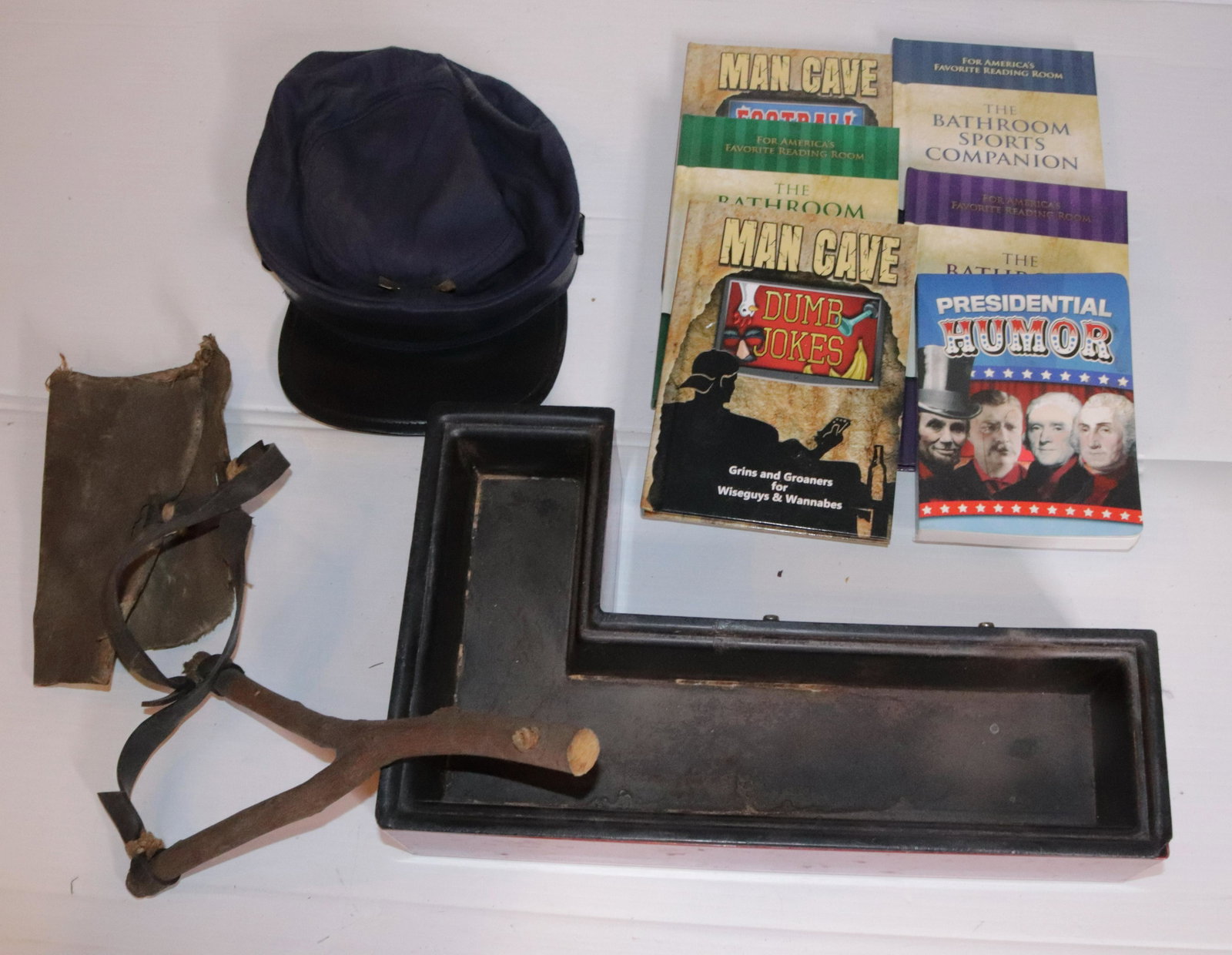 GROUP LOT OF SMALLS: INCLUDES: BOOKS, SLINGSHOT, LETTER "L" AND MORE Disclaimer PLEASE READ BEFORE BIDDING!!! Pick-up will be Tuesday January 5th, 2021 from 9:00am till 5:00pm and Thursday January 7th, 2021 from 9:00am ti