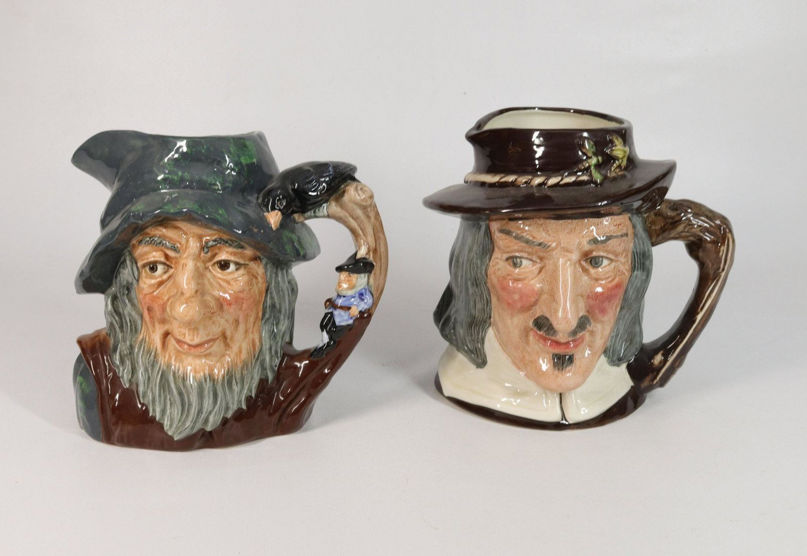 PAIR OF ROYAL DOULTON TOBY JUGS: RIP VAN WINKLE D6438, 1954 AND IZAAK WALTON D6404, 1953 Size 7" H