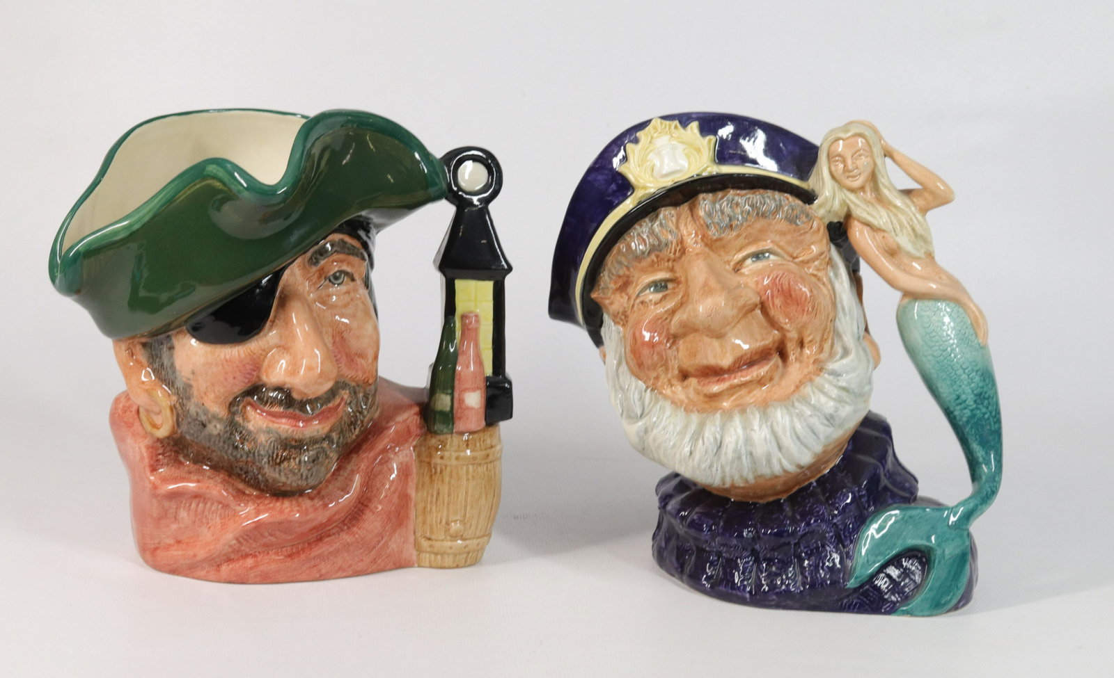 PAIR OF ROYAL DOULTON TOBY JUGS: OLD SALT D6651, 1960 AND SMUGGLER D6616, 1967 Size 7 1/2" H
