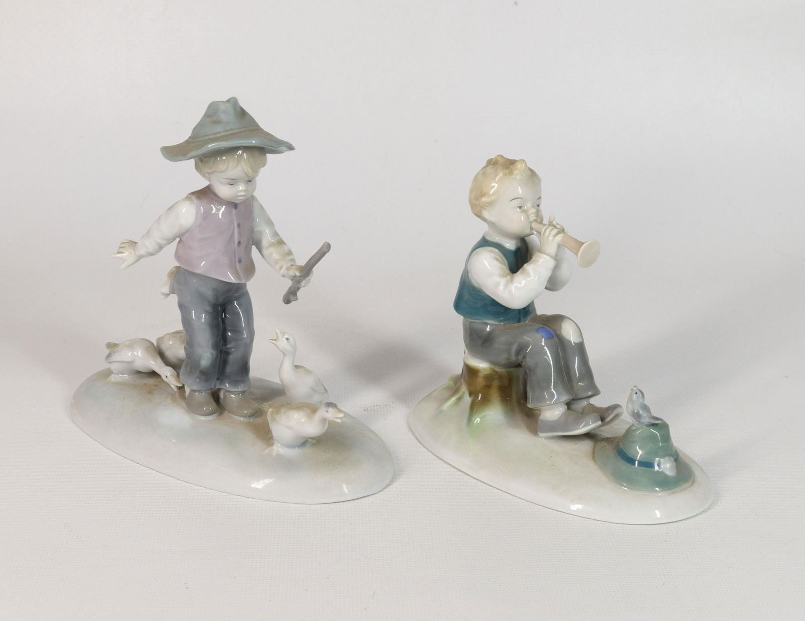 PAIR OF GERMAN PORCELAIN FIGURES (1 of 3)