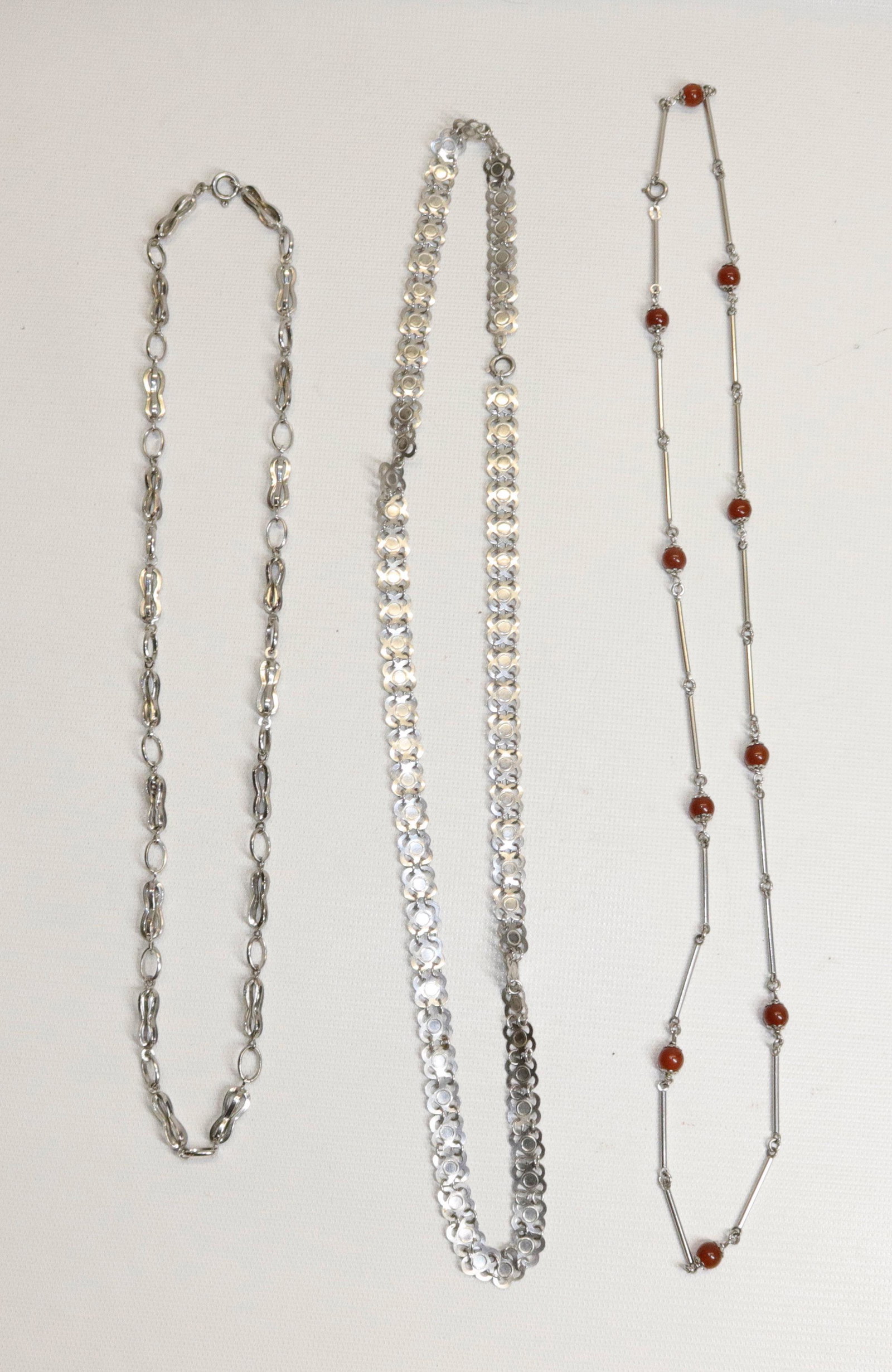 THREE SILVER CHAINS: ONE WITH CARNELIAN BEADS. 3 OZT Size 23", 26" AND 27" L