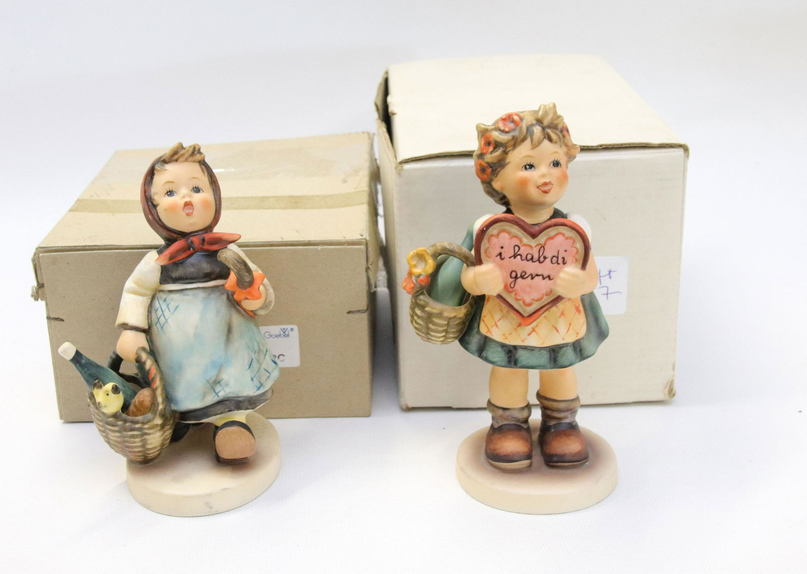 PAIR OF GOEBEL HUMMEL PORCELAIN FIGURES: VALENTINE GIFT #387, W. GERMANY WITH BOX AND TO MARKET #382, W.GERMANY WITH BOX Size 5" TO 5 1/2" H