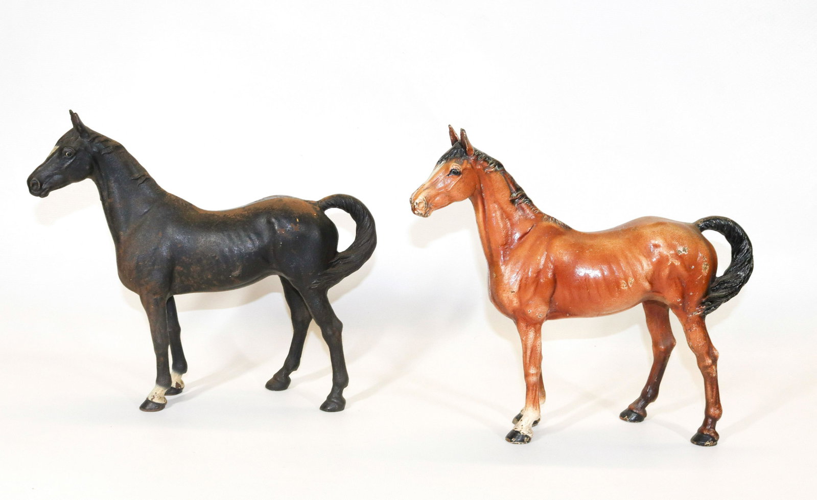 PAIR OF CAST HORSE DOORSTOPS: TWO PAINTED CAST IRON DOORSTOPS BY HUBLEY Dimensions 10 1/2" X 11 3/4"