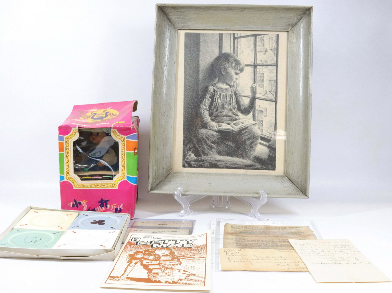 GROUP LOT OF VINTAGE ITEMS: INCLUDING: CERAMIC ASHTRAYS WITH CARD SUITE MOTIF, PA RAILROAD PAPERS, BETTY MAE 1996 ADULT BOOK, LITTLE PERFORMER WIND-UP TOY IN BOX AND PRINT OF A CHILD Dimensions PRINT IN FRAME 17 1/2" X 14 1/2"