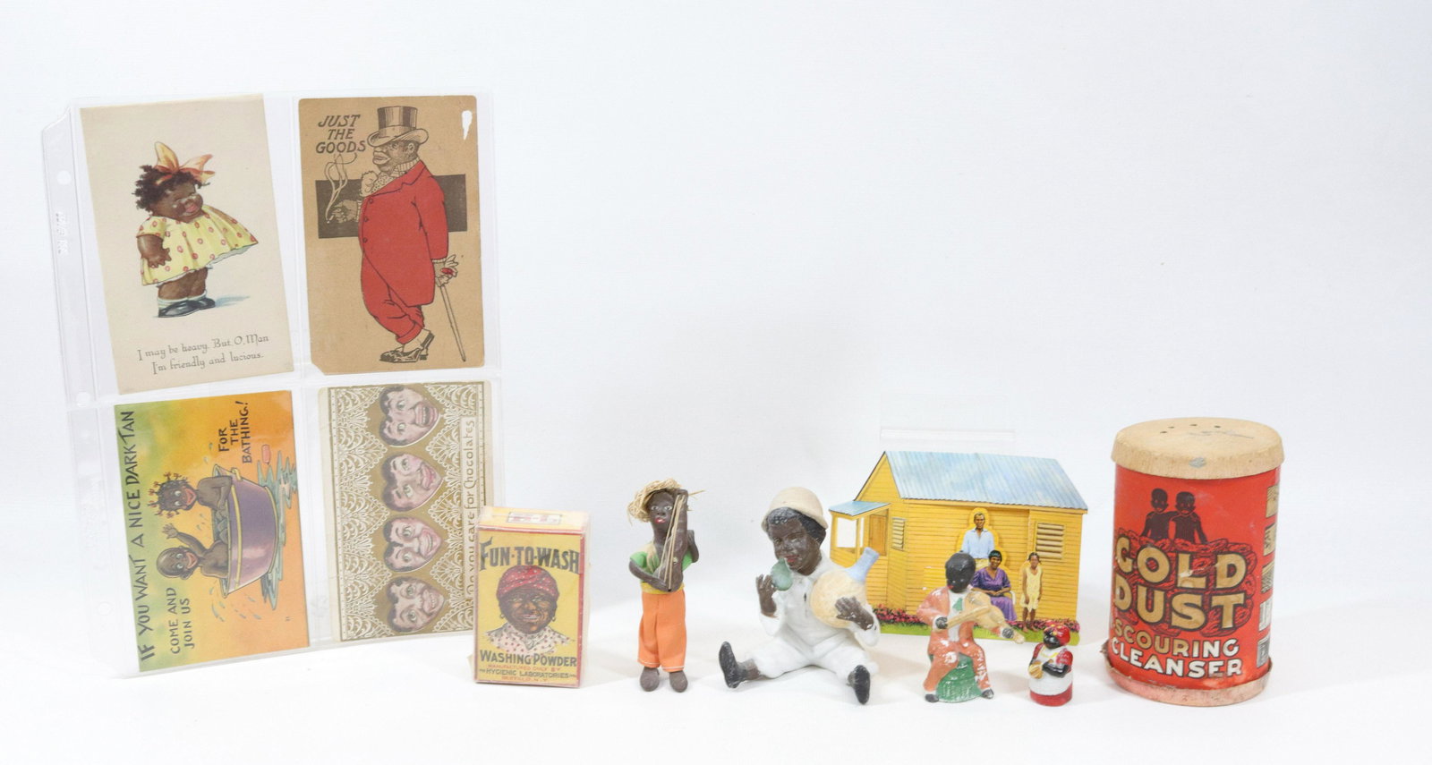 GROUP LOT OF BLACK AMERICANA: INCLUDING: BISQUE FIGURE OF CHILD, MAMMY THIMBLE, MOVEABLE HEAD VIOLINIST, GOLD DUST CLEANER, FUN-TO-WASH POWDER AND POSTCARDS Dimensions GOLD DUST CONTAINER 5" H