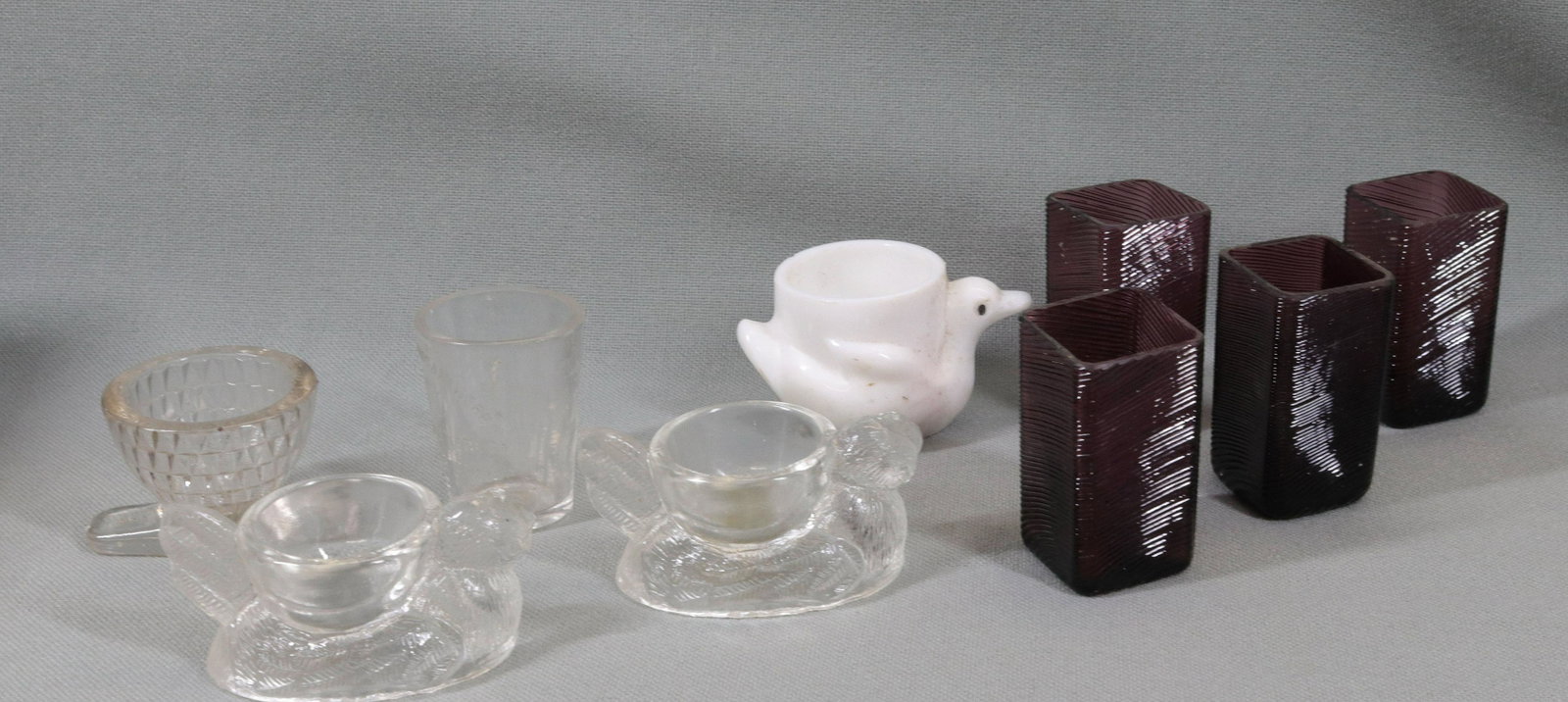GROUP LOT OF EARLY GLASSWARE: (4) EGG CUPS, (4) BLOWN AMETHYST TOOTHPICKS AND PERKINS AMERICAN HERBS MEASURE Dimensions 1 3/4" TO 2 3/4" H