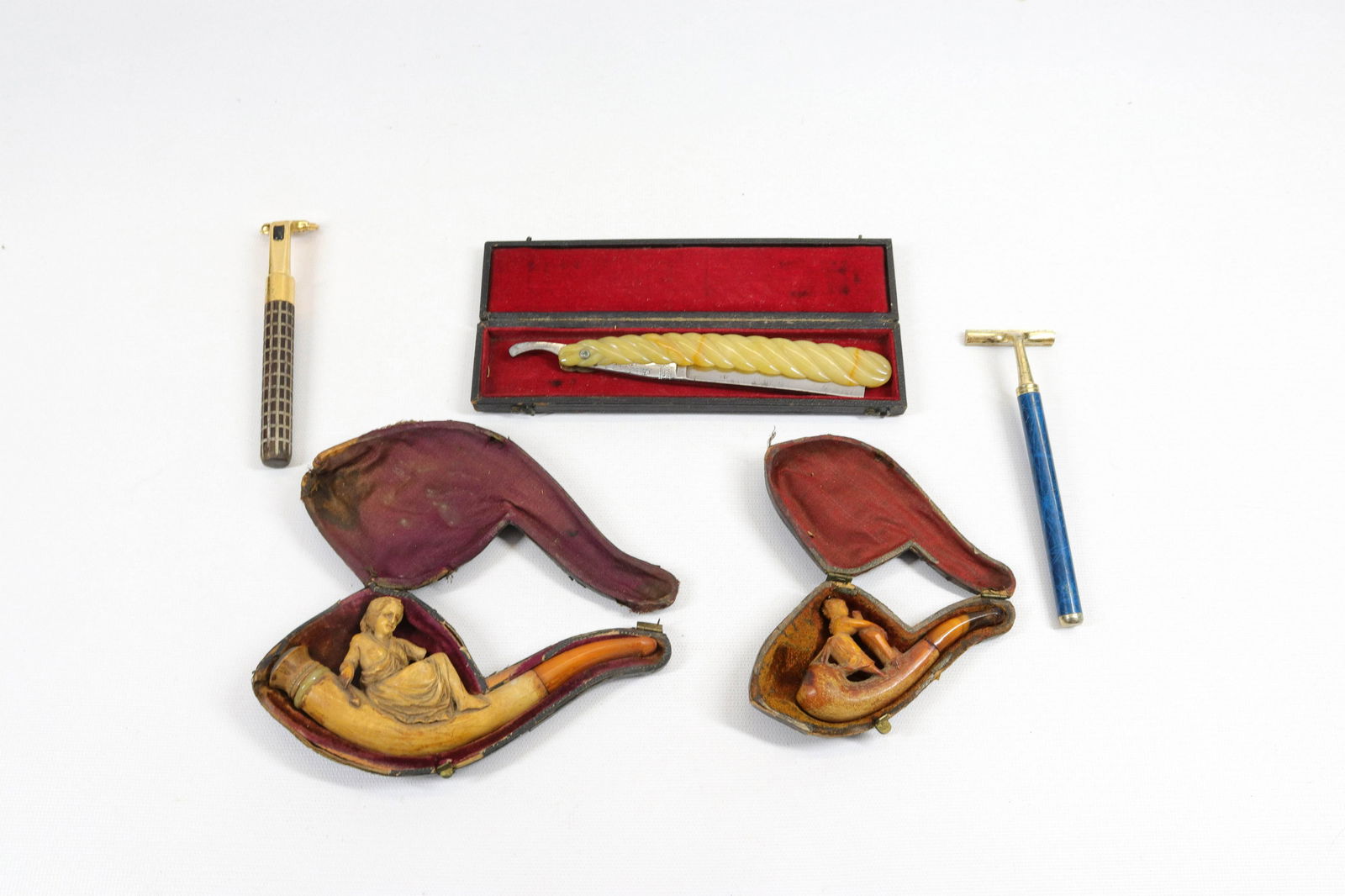 GROUP LOT OF MEERSCHAUM PIPES AND RAZORS: (2) PIPES IN CASES, STRAIGHT RAZOR IN CASE AND TWO RAZORS Dimensions LARGEST PIPE 5 1/4" L