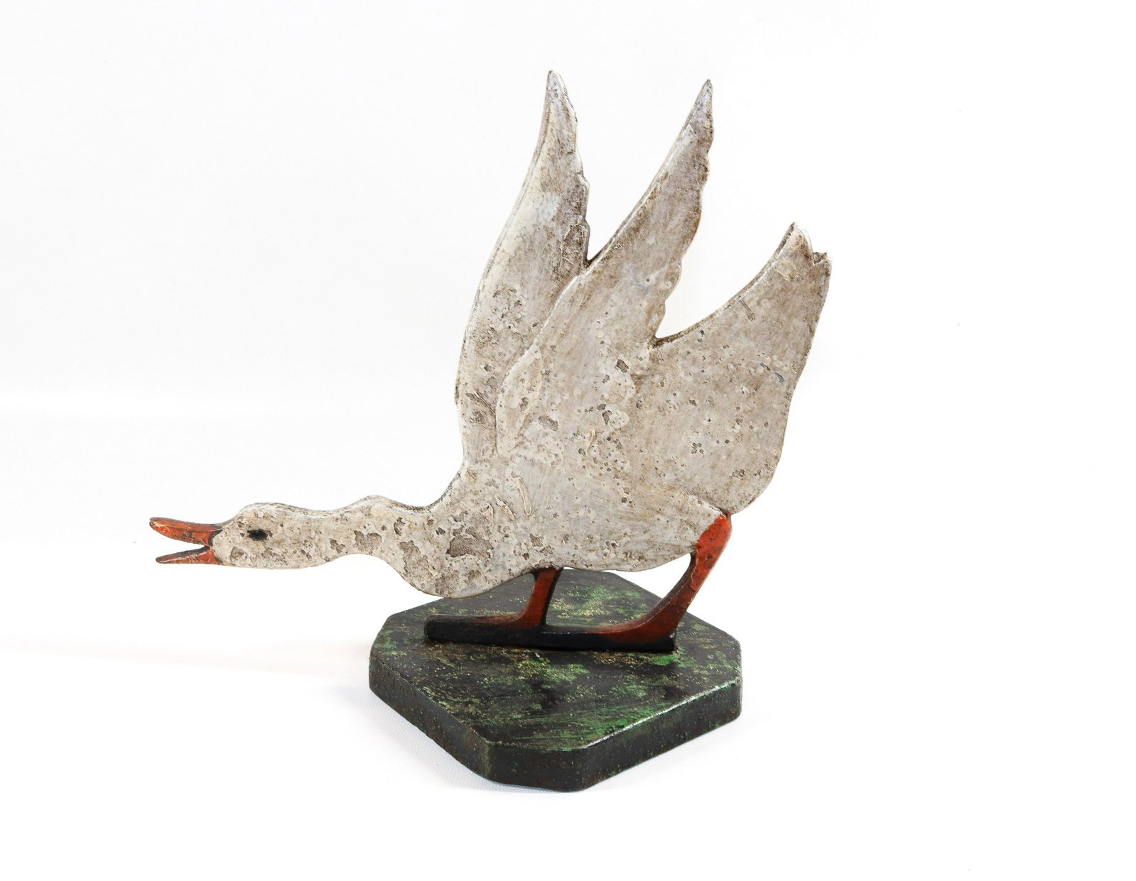 CAST IRON GOOSE DOORSTOP: GOOSE BOLTED TO BASE. PAINTED SURFACE Dimensions 10 1/2" X 10"