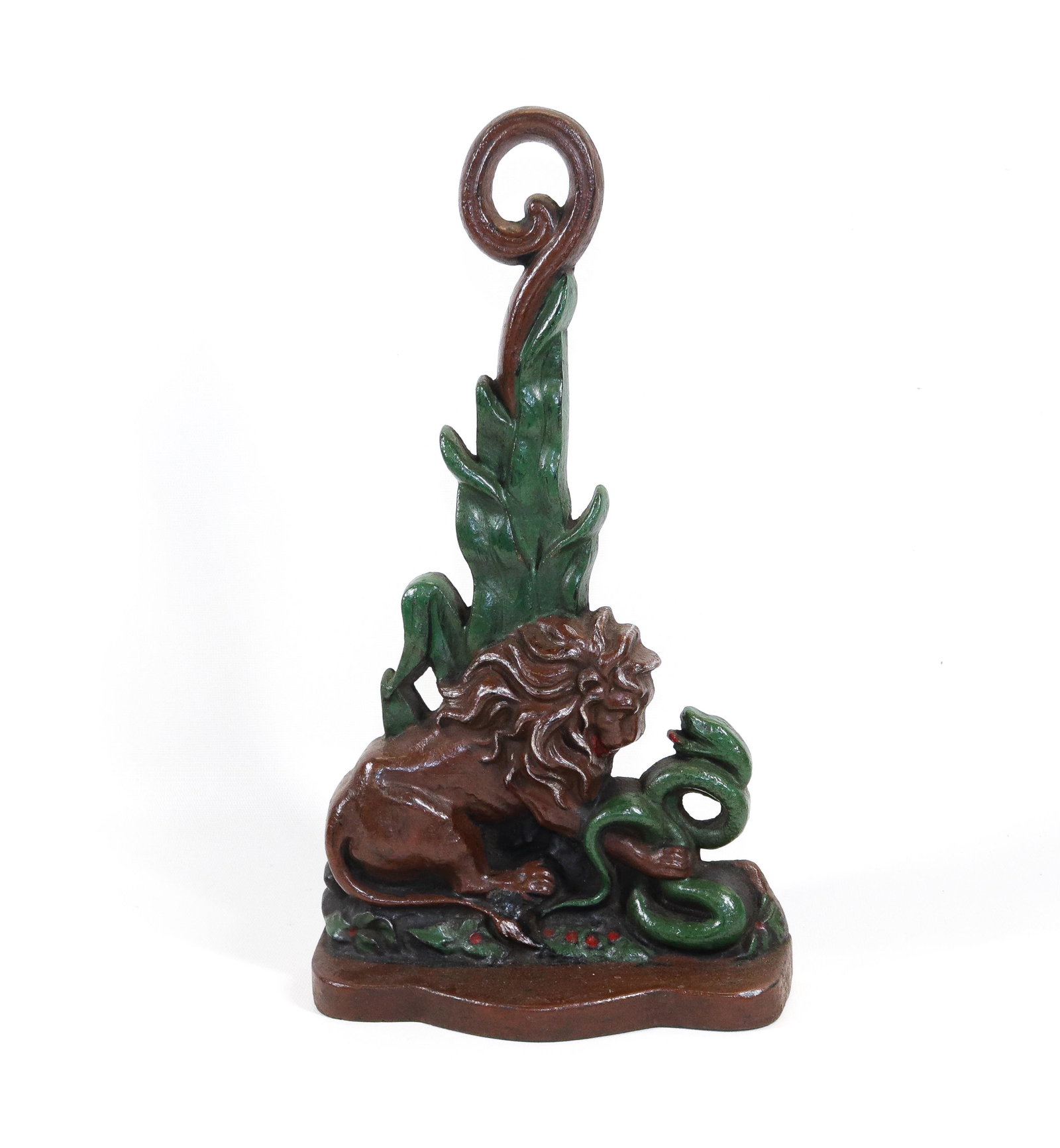 CAST IRON LION DOORSTOP: PAINTED SURFACE. SNAKE AND LION. MRKD. ON BACK 383 Dimensions 14" H