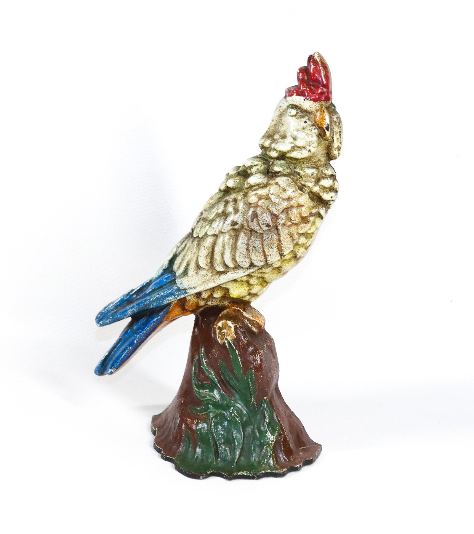 CAST IRON COCKATOO DOORSTOP: PAINTED SURFACE. BIRD ON STUMP. MRKD. ALBANY FOUNDRY CO. #81 Dimensions 12" H