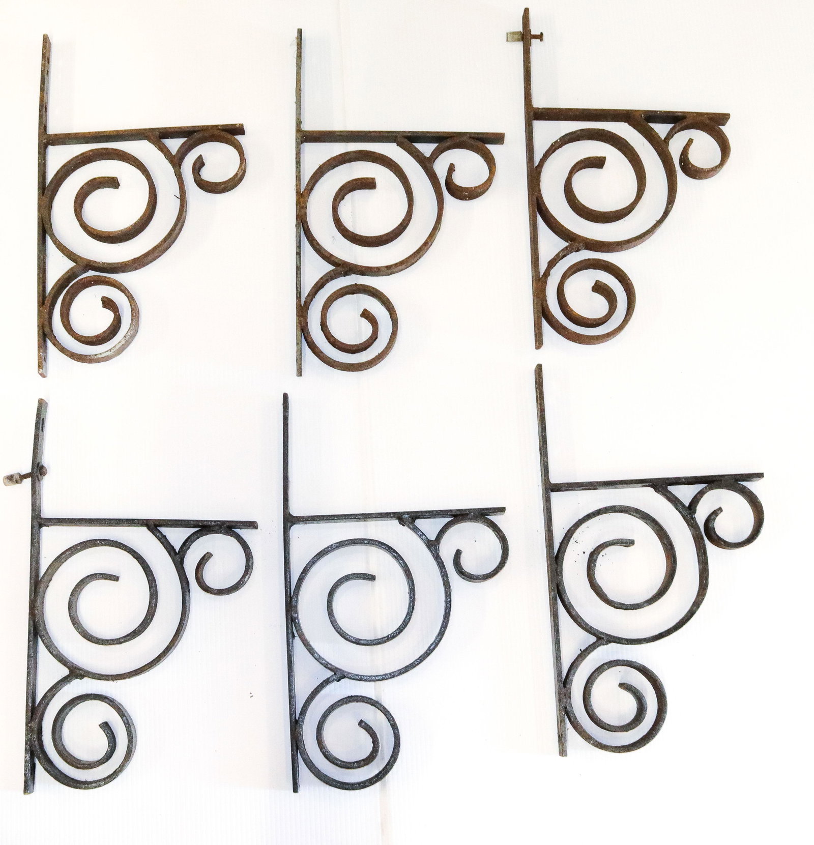 GROUP LOT OF WROUGHT IRON BRACKETS: SIX BRACKETS. SOME HAVE BLACK PAINTING Dimensions 18" X 10 1/4"