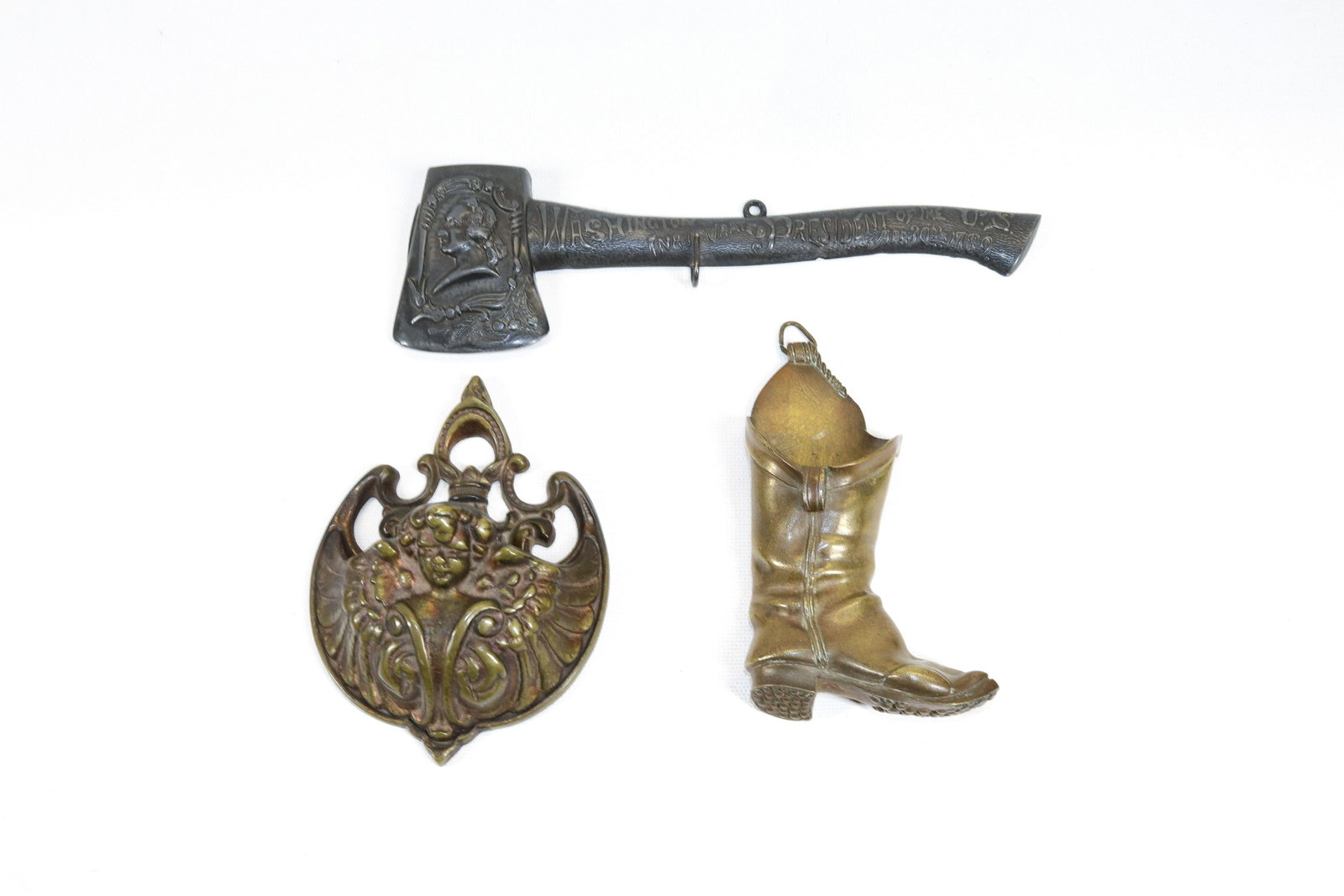 GROUP LOT OF HANGING MATCH HOLDERS: TWO BRASS MATCH HOLDERS AND METAL GEORGE WASHINGTON COMMEMORATIVE INAUGURATION HATCHET Dimensions BOOT 5" H