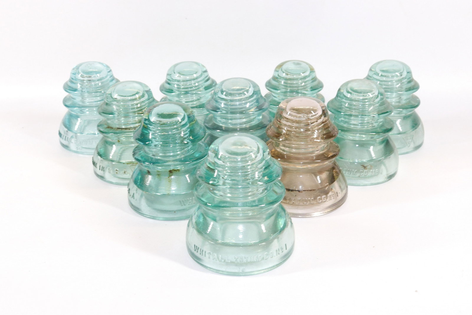 GROUP LOT OF WHITALL TATUM INSULATORS: (10) GLASS INSULATORS. AQUA AND CLEAR