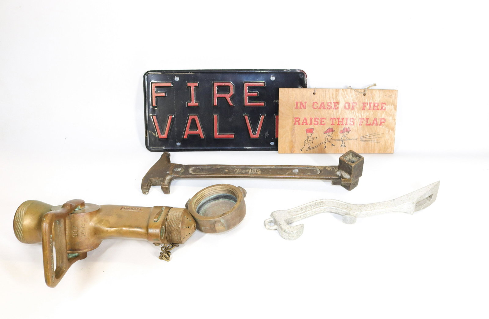 GROUP LOT OF FIRE EQUIPMENT: INCLUDING: BRASS FOG NOZZLE, BRASS BERYLCO W150 WRENCH, AKRON STYLE 10 ALUMINUM WRENCH, FIRE VALVE PLATE AND HEAVY BRASS END CAP Dimensions NOZZLE 10" L