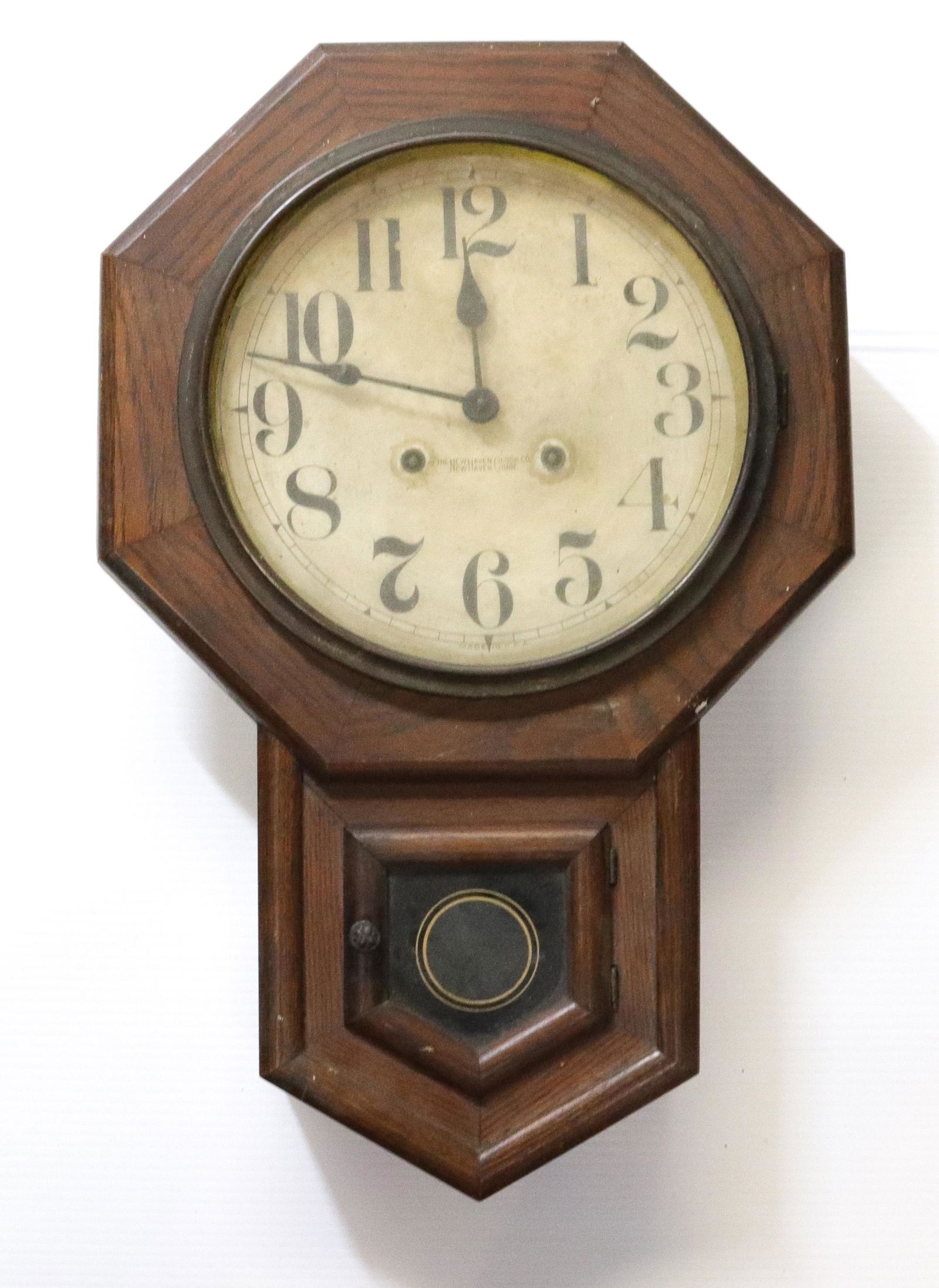 NEW HAVEN WALL CLOCK: OAK OCTAGONAL CASE. NO PENDULUM OR KEY. Dimensions 21 1/2" X 14"