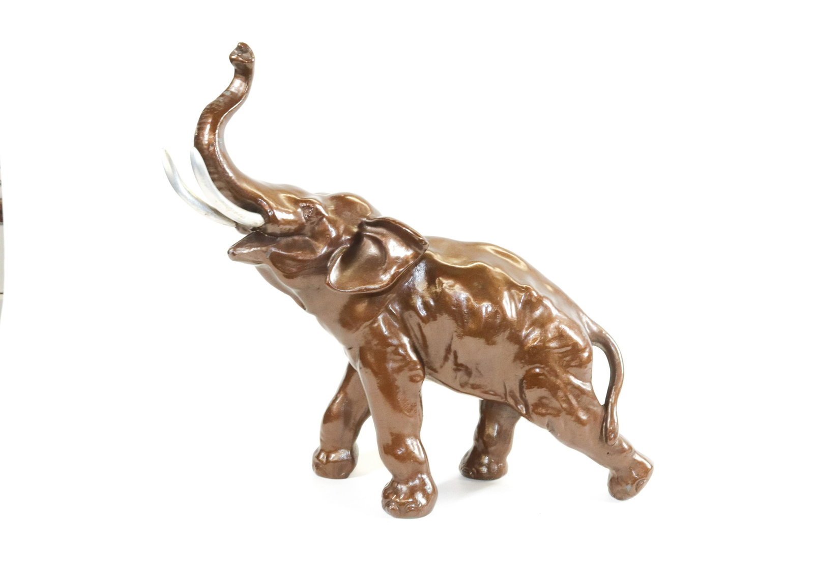 VINTAGE ELEPHANT DOORSTOP: HOLLOWED BODY PAINTED METAL. TRUNK P WITH TWO SILVER TUSKS Dimensions 13 1/2" X 16"