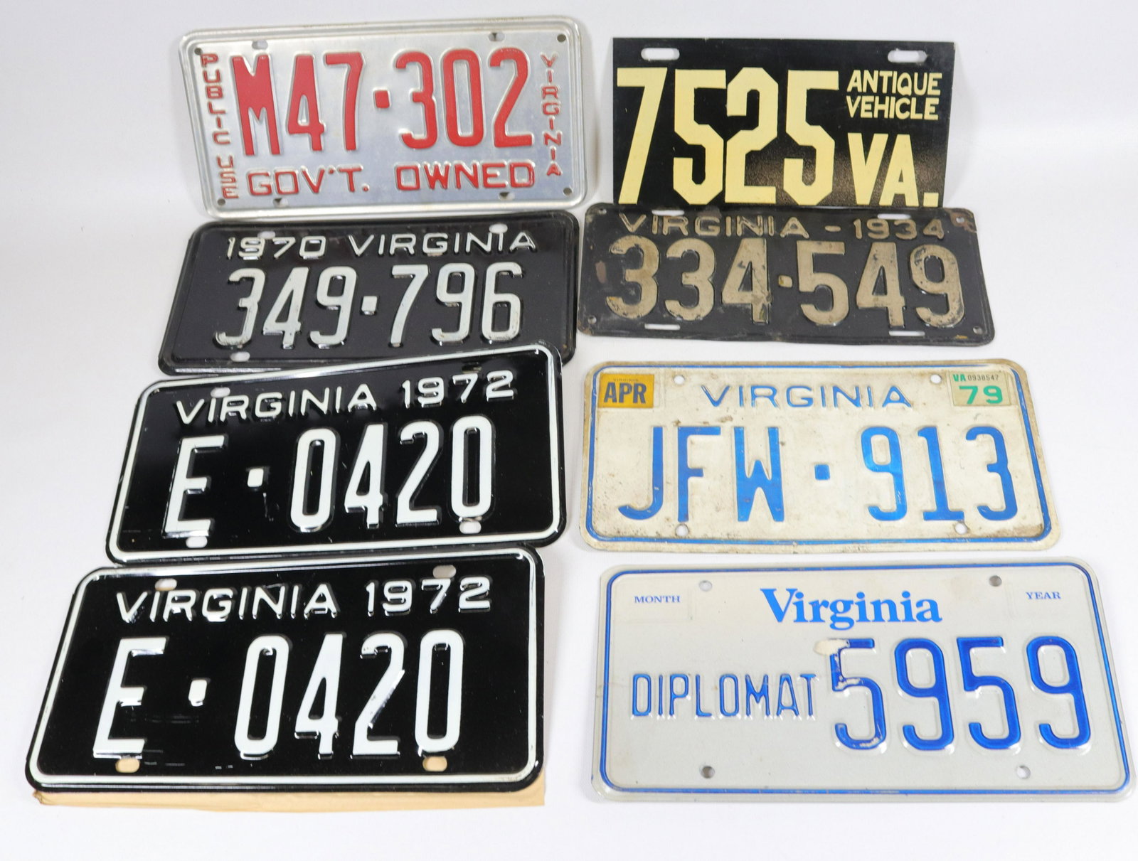 VIRGINIA LICENSE PLATE LOT: (8) PAINTED PRESSED STEEL INCLUDING - ANTIQUE VEHICLE PLATE, PRESSED ALUMINUM GOVERNMENT PLATE, 1970, MATCHING PAIR OF 1972 PLATES, WHITE AND BLUE AUTO PLATE, 1934 PLATE, AND DIPLOMAT PLATE 6" X 12"
