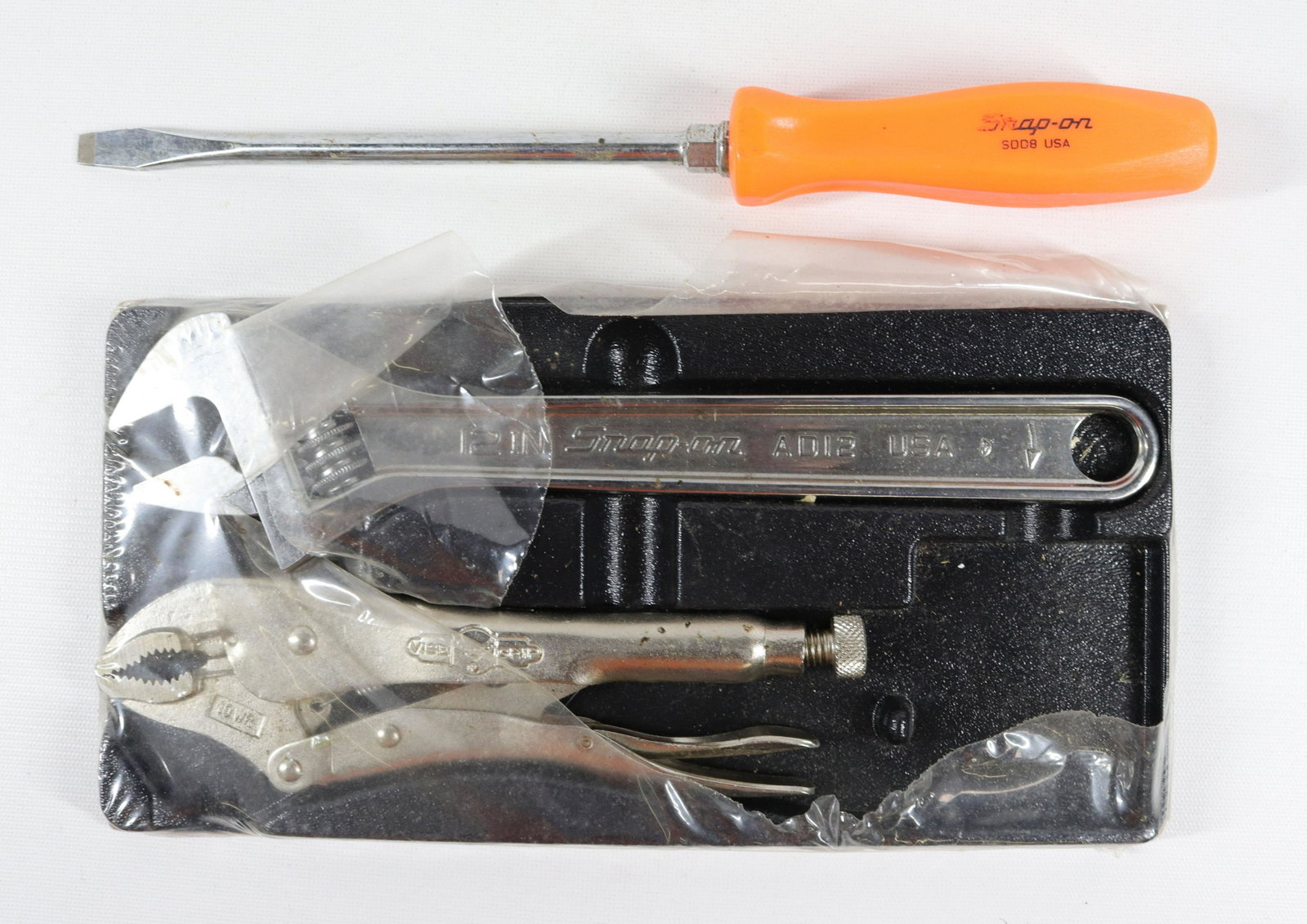 SNAP-ON TOOL LOT: INCLUDING: ORANGE HANDLED SCREWDRIVER, ADJUSTABLE 12IN. WRENCH, PETERSEN VISE GRIP