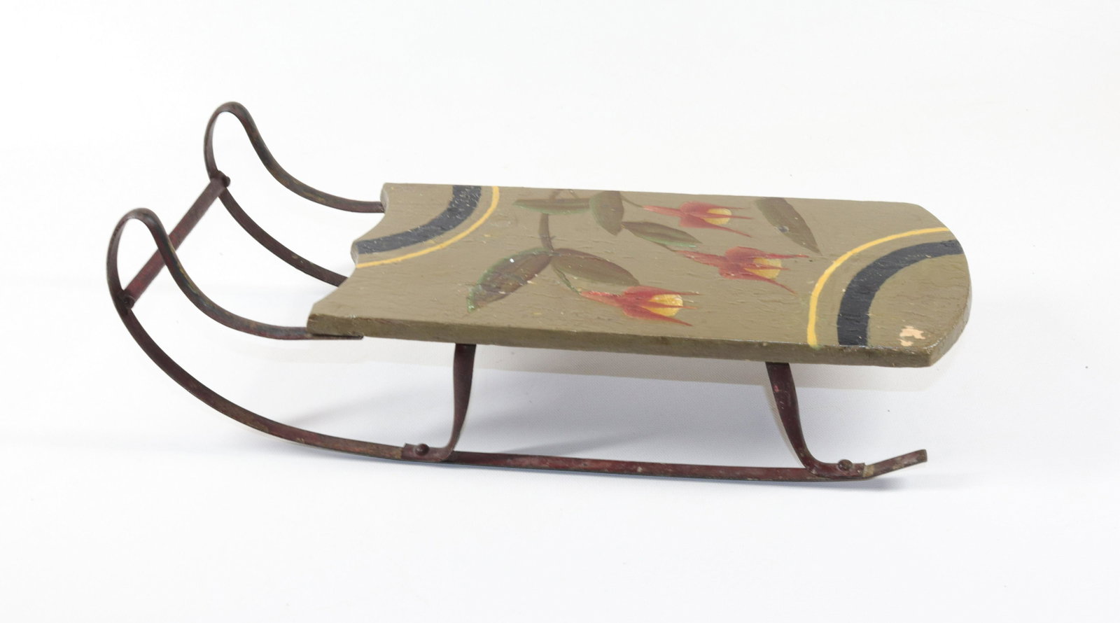 PAINTED MINIATURE SLED: WOOD AND IRON. FLORAL MOTIF. MRKD. "J.P. SHEPHERD, 1899" ON BOTTOM. Size: 3" X 5" X 15"