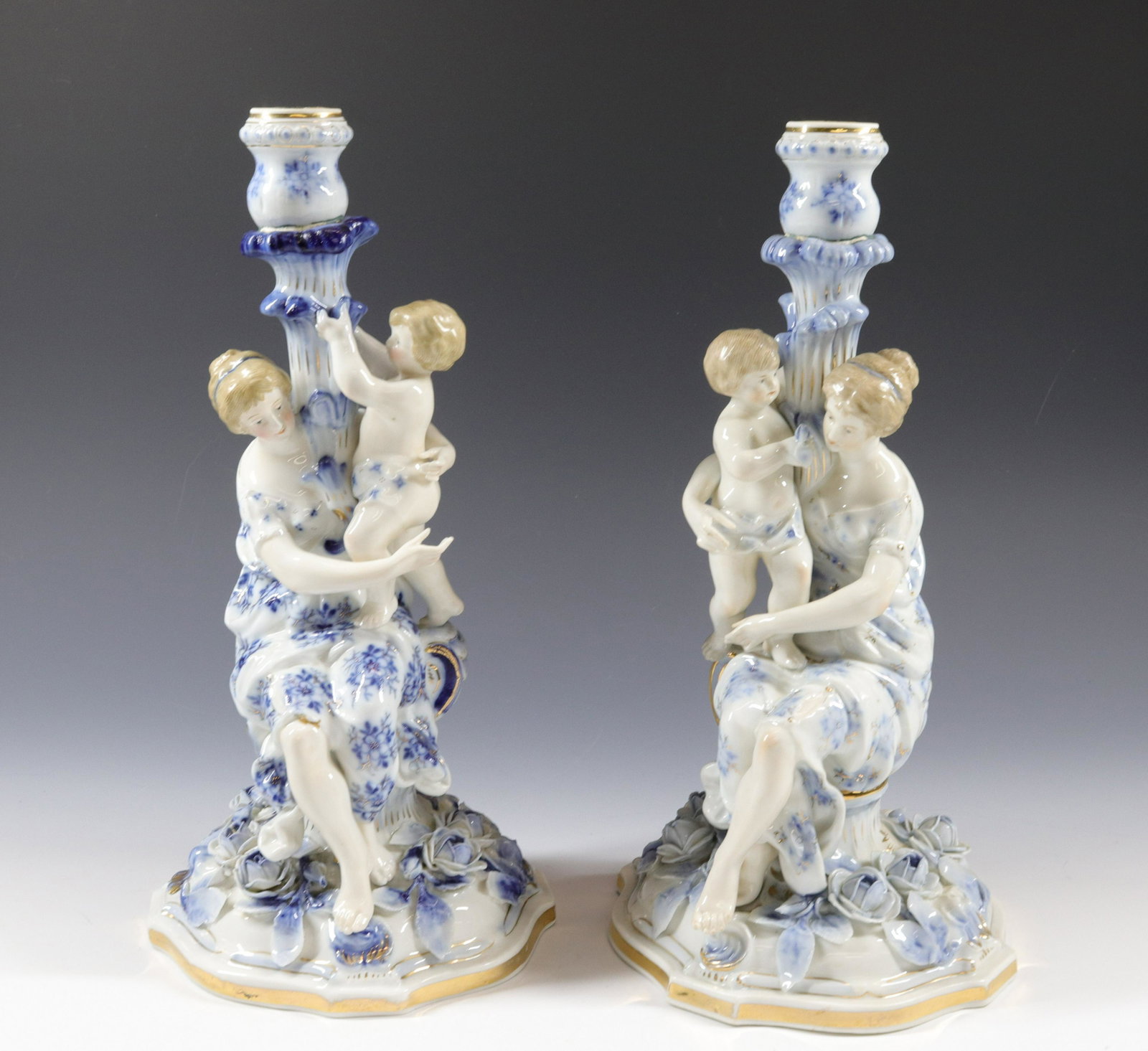 PAIR OF COBALT AND WHITE FIGURINES: CANDELABRA FIGURES - FACES HAVE FINE DETAIL Size: 13"