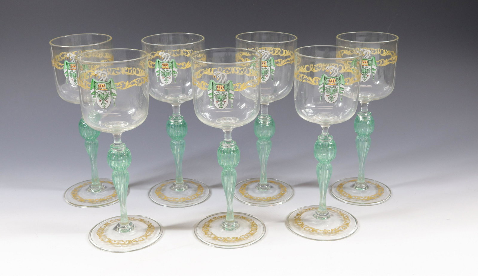 VENETIAN STEMWARE LOT: (7) WINE GLASSES WITH ENAMEL CREST AND GOLD DECORATION Size: 8"