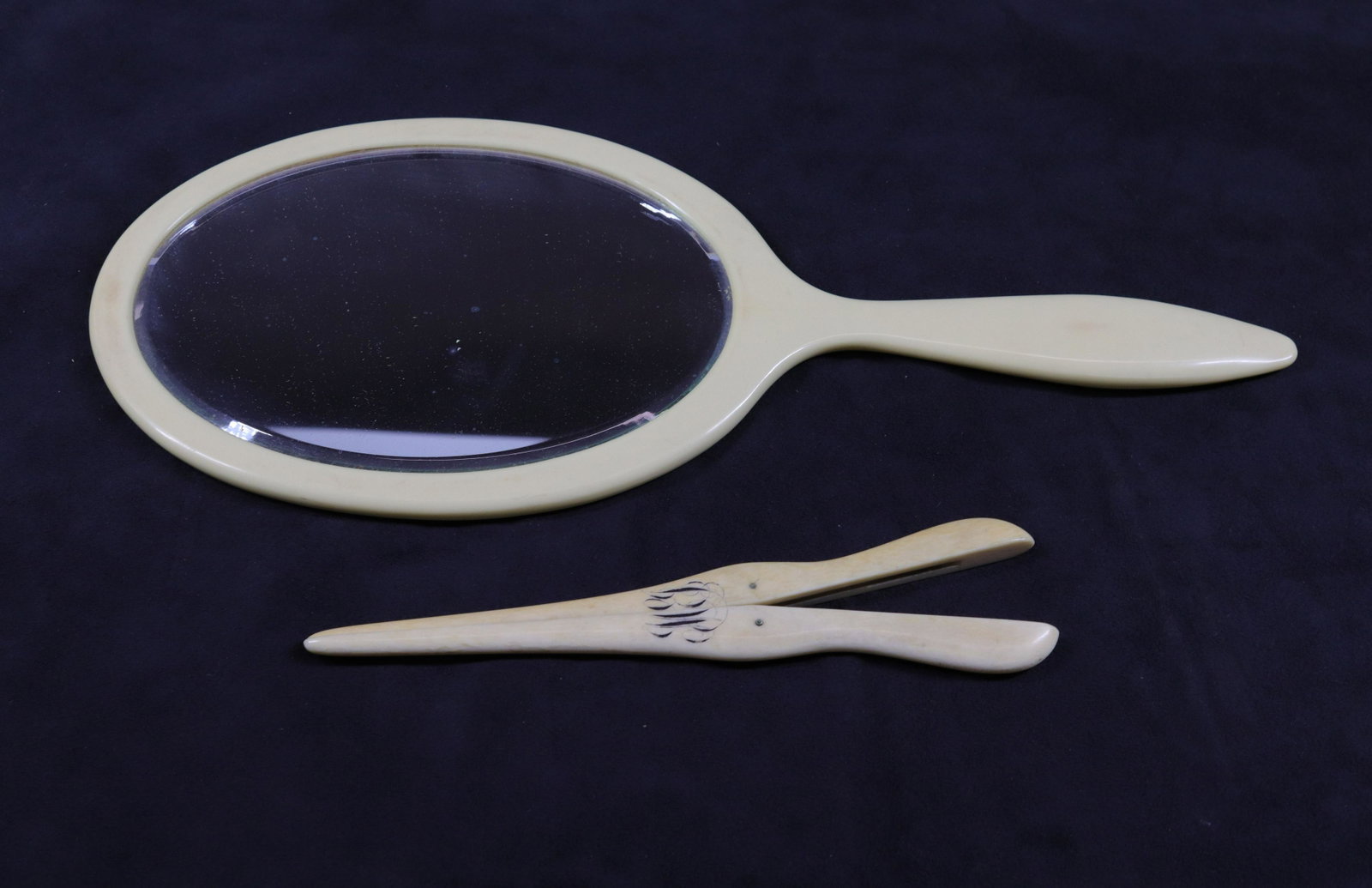 HAND MIRROR AND GLOVE STRETCHER: DOUBLE SIDED HAND MIRROR - BONE GLOVE STRETCHER Size: 7 1/4" - 13 1/2" X 5 1/2"