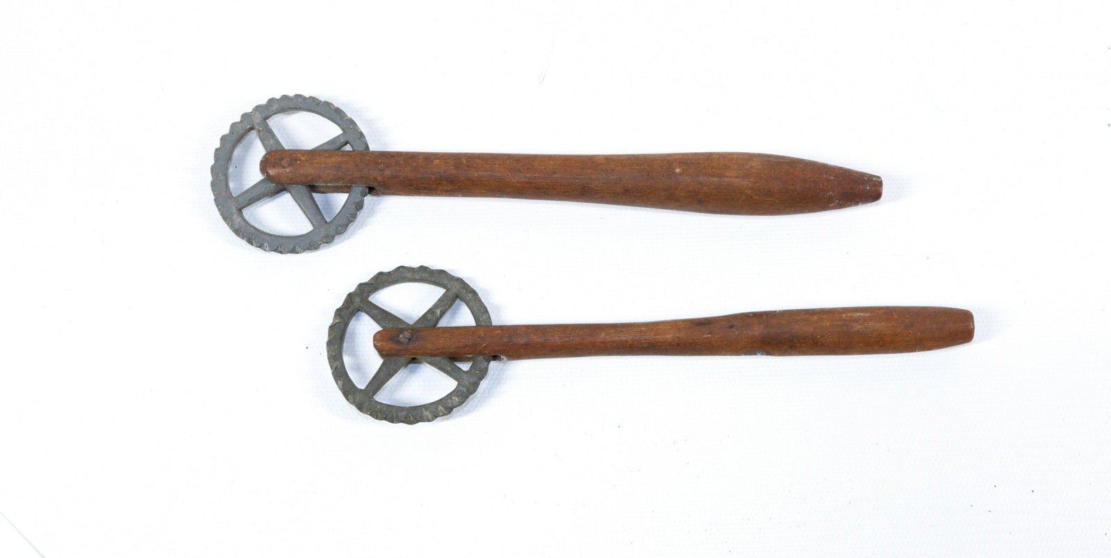 PR. OF 19TH CENTURY PIE CRIMPERS: NEAR MATCHING PAIR WITH PEWTER WHEELS AND WOODEN HANDLES Size: 7" TO 7 1/2" L