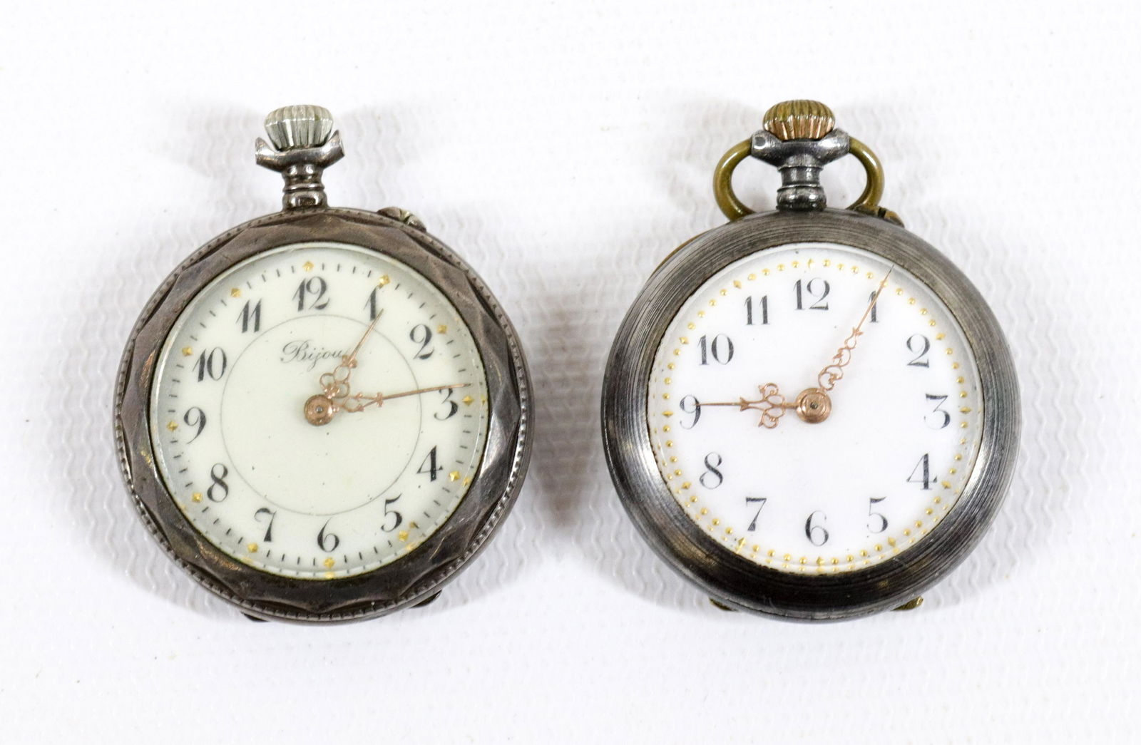 PR. OF SILVER LADIES POCKET WATCHES: PORCELAIN FACED WITH GOLD HANDS - WIND-UP WATCHES - FLORAL DECORATION CASES Size: 1 1/2" X 1"